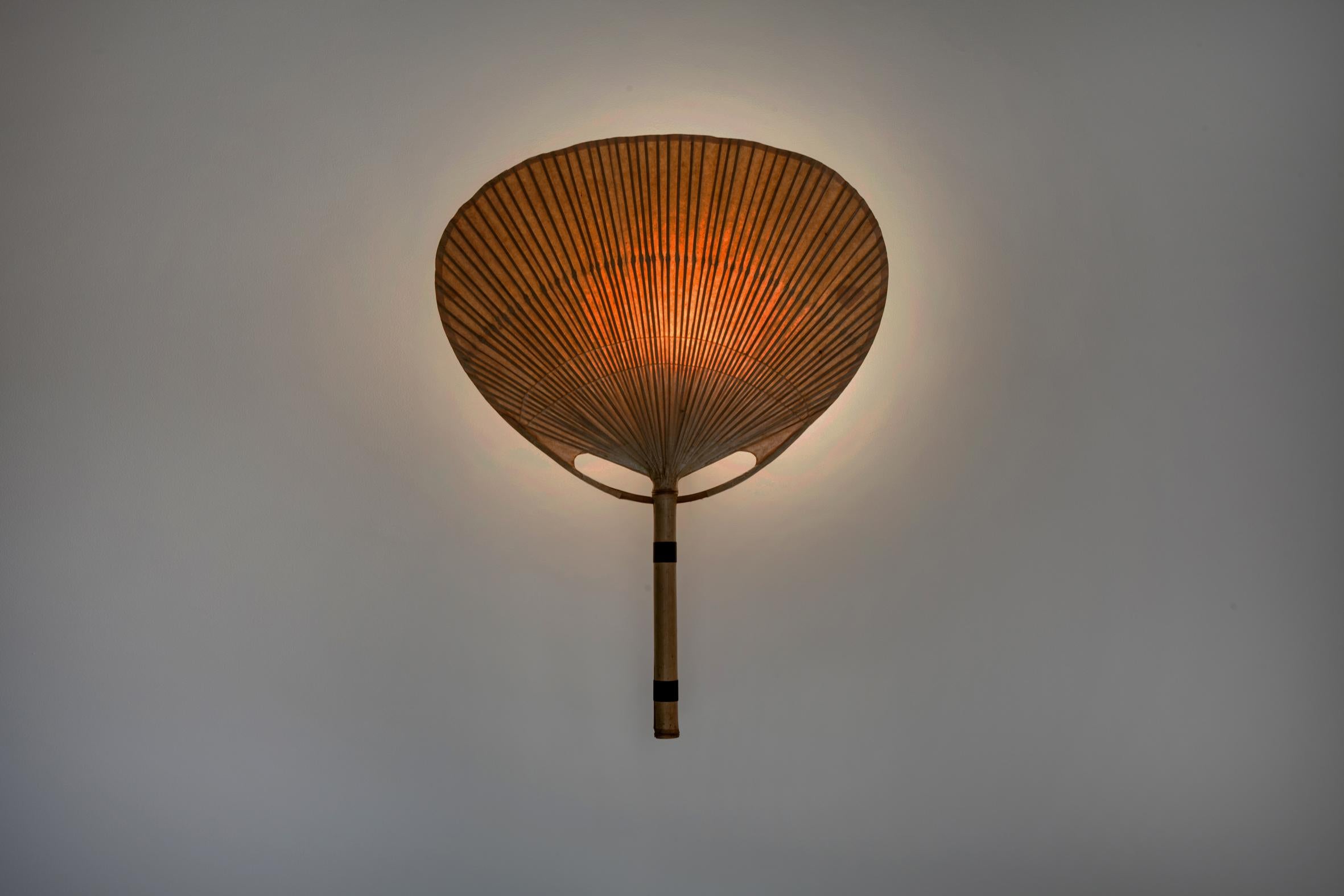 Appliqué 'Uchiwa III', created by Ingo Maurer for Design M.
Bamboo, rice paper and black lacquered metal suspension.