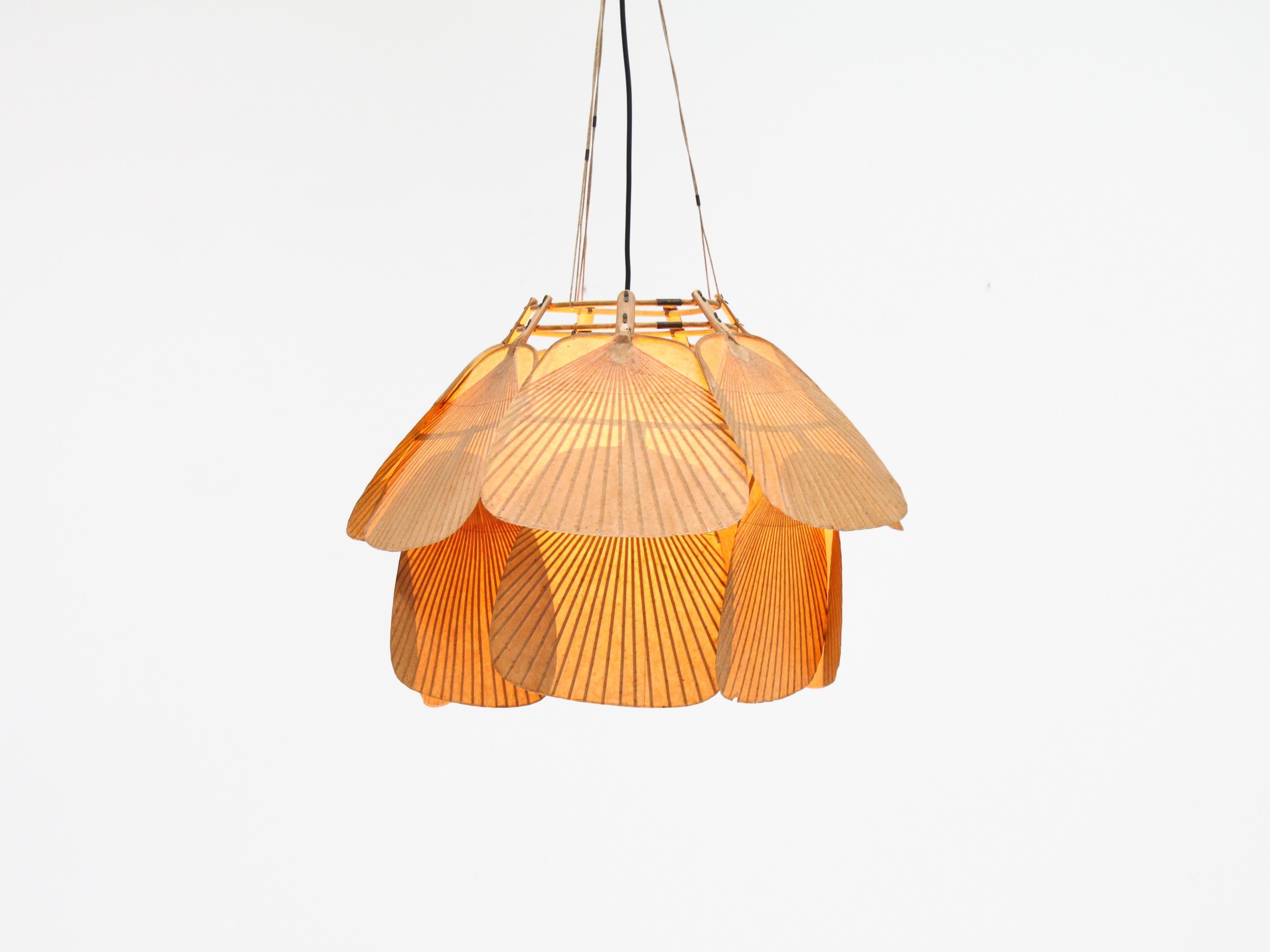A wonderful and rare large 14 fan ‘Uchiwa Ju-Yon’ bamboo and Japanese rice paper Chandelier by Ingo Maurer for M design, Germany, 1970s.

Ingo Maurer’s interest in paper for lampshades was linked with his interest in Japan. From 1973-1975 he