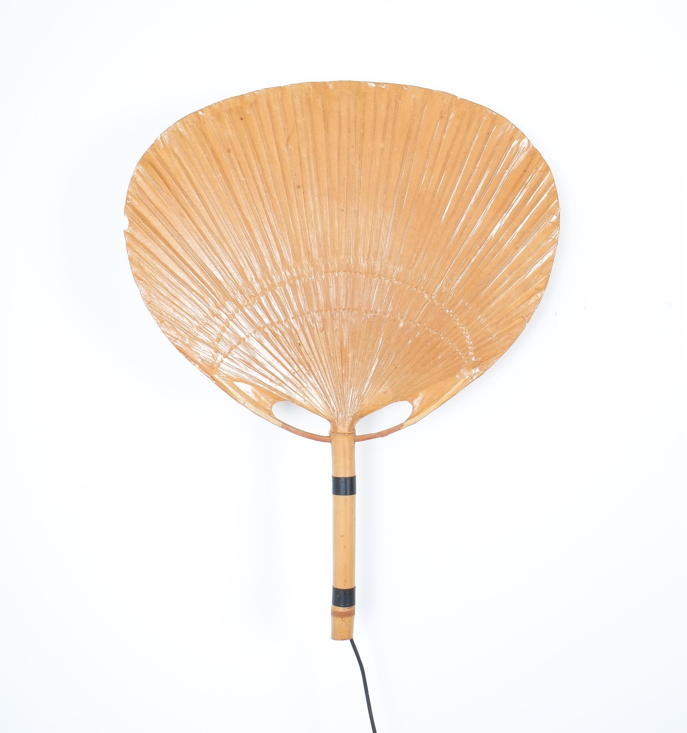 Ingo Maurer Uchiwa pair of paper wall lights, Germany, 1970. Nice pair of large Uchiwa lamps (a Japanese Uchiwa is a fan basically) made from paper and bamboo in fair to good condition. Measurements are 30