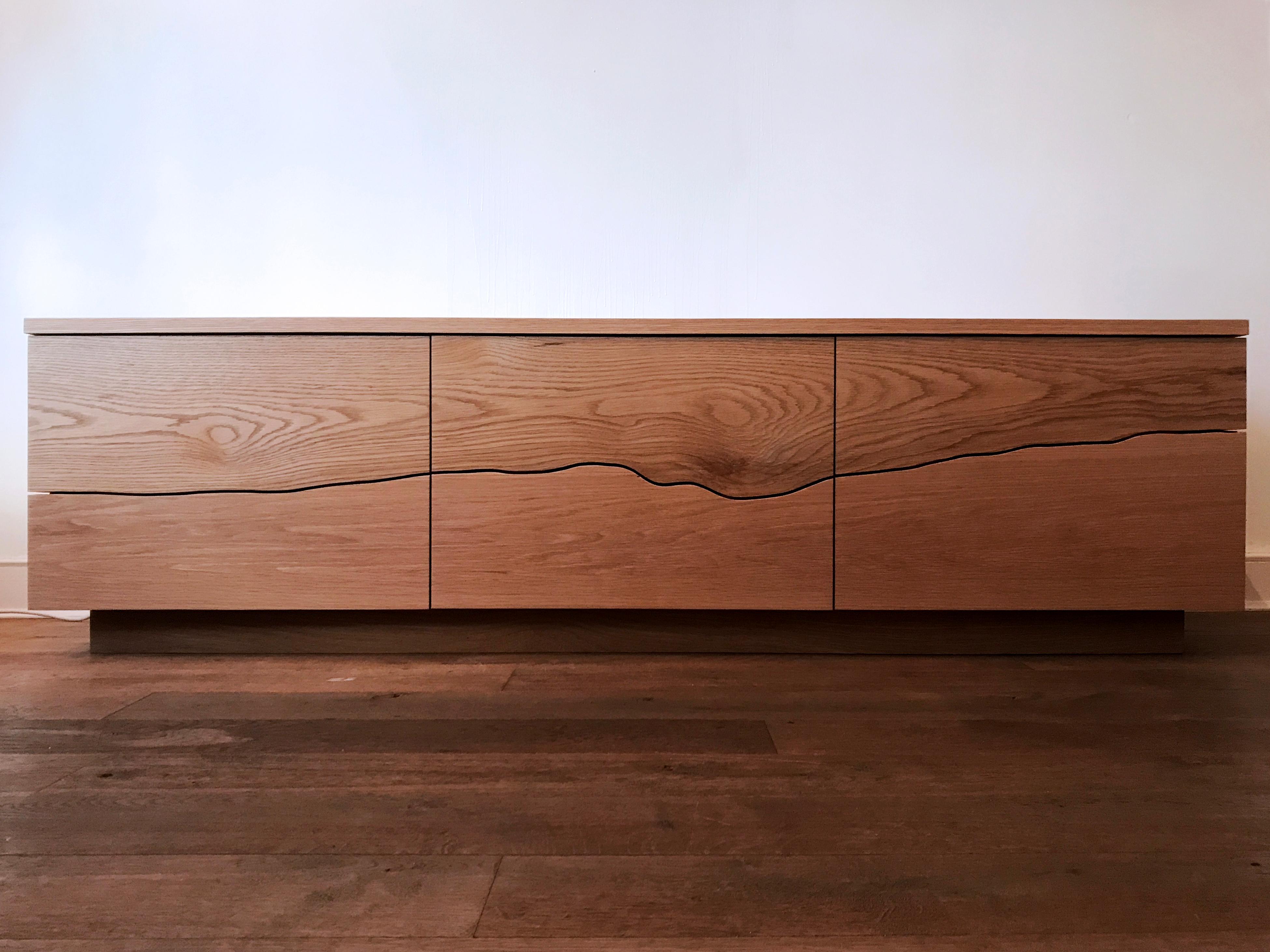Ingrained sideboard by Adam Blencowe
Materials: Oak
Dimensions: 180 x 50 x 55 cm

We use the Ingrained design across three pieces of furniture, wardrobes, dressers and sideboards. There made to our clients size and finish