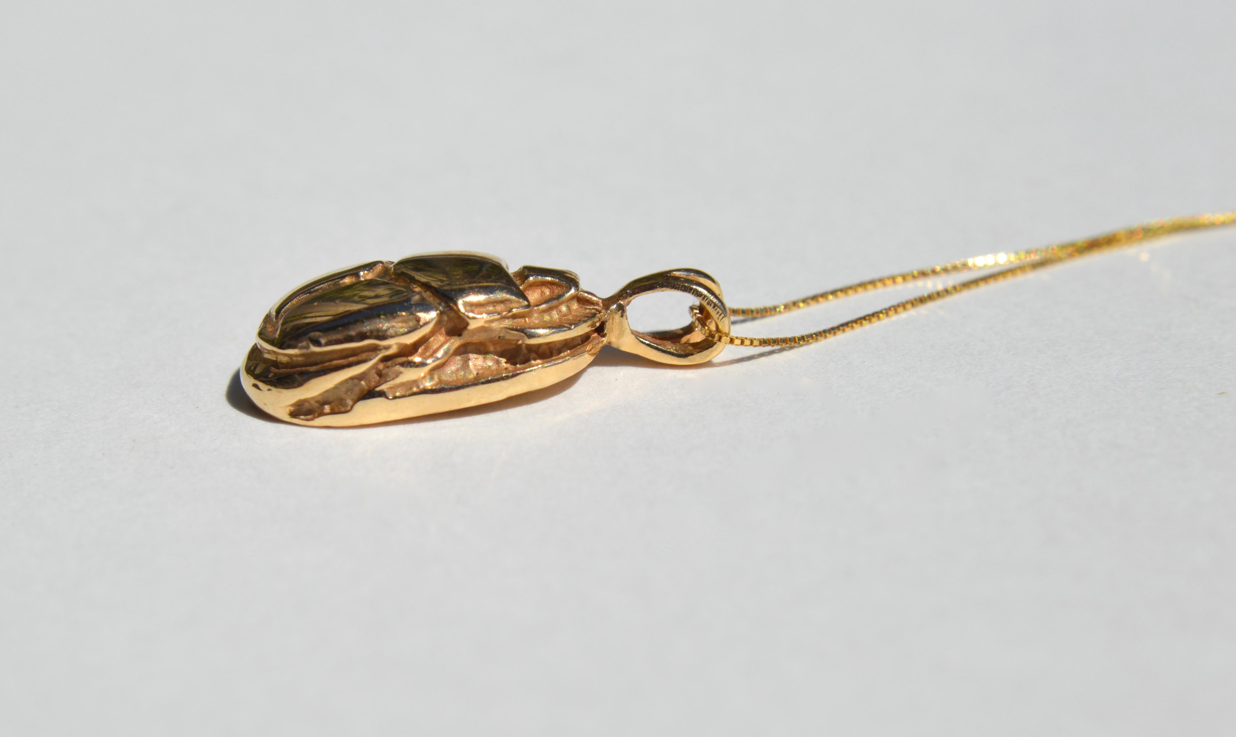 Beautiful Egyptian revival scarab beetle charm in solid 14K yellow gold, cast from an Art Deco era original. Ancient Egyptian symbols or scene on back. 3/4