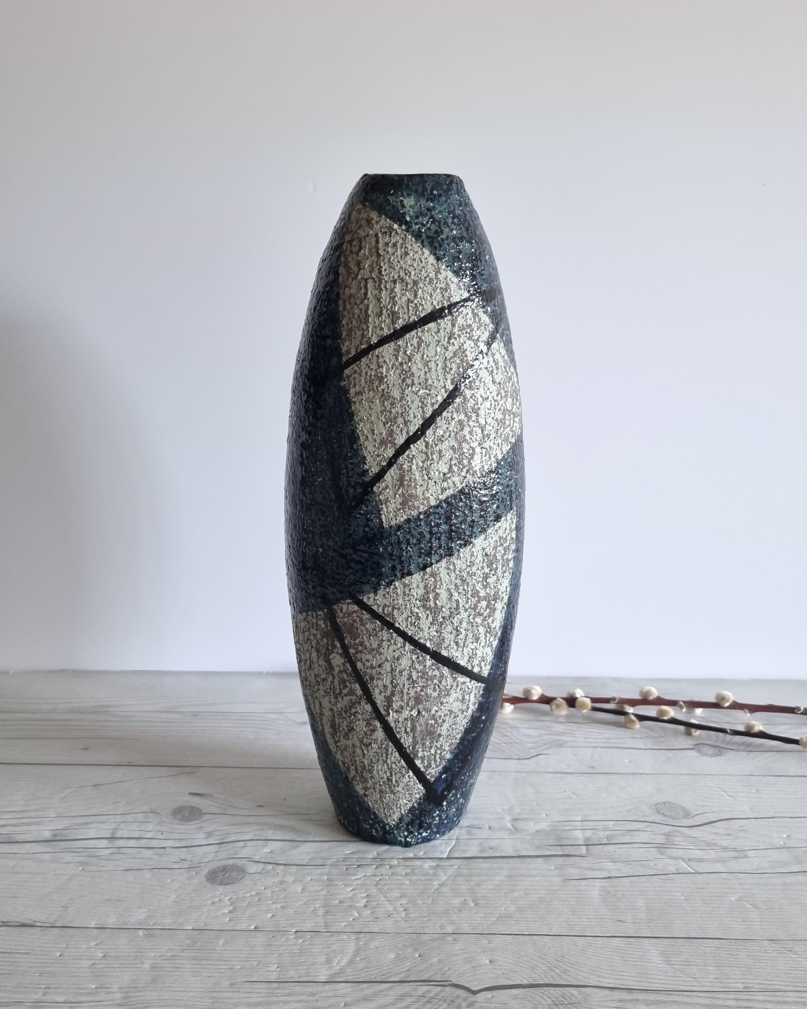 This statement work of Mid-Century Modern design is by Ingrid Atterberg, (b. 1920 - d. 2008) a celebrated epitome for illustrious 20th century Swedish ceramic design. Atterberg was also a leading designer for Upsala Ekeby for whom she designed this