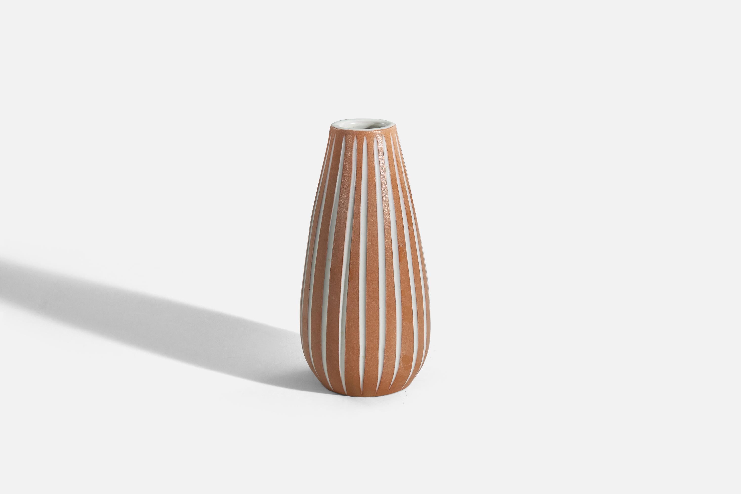 An orange and white, glazed earthenware vase, 