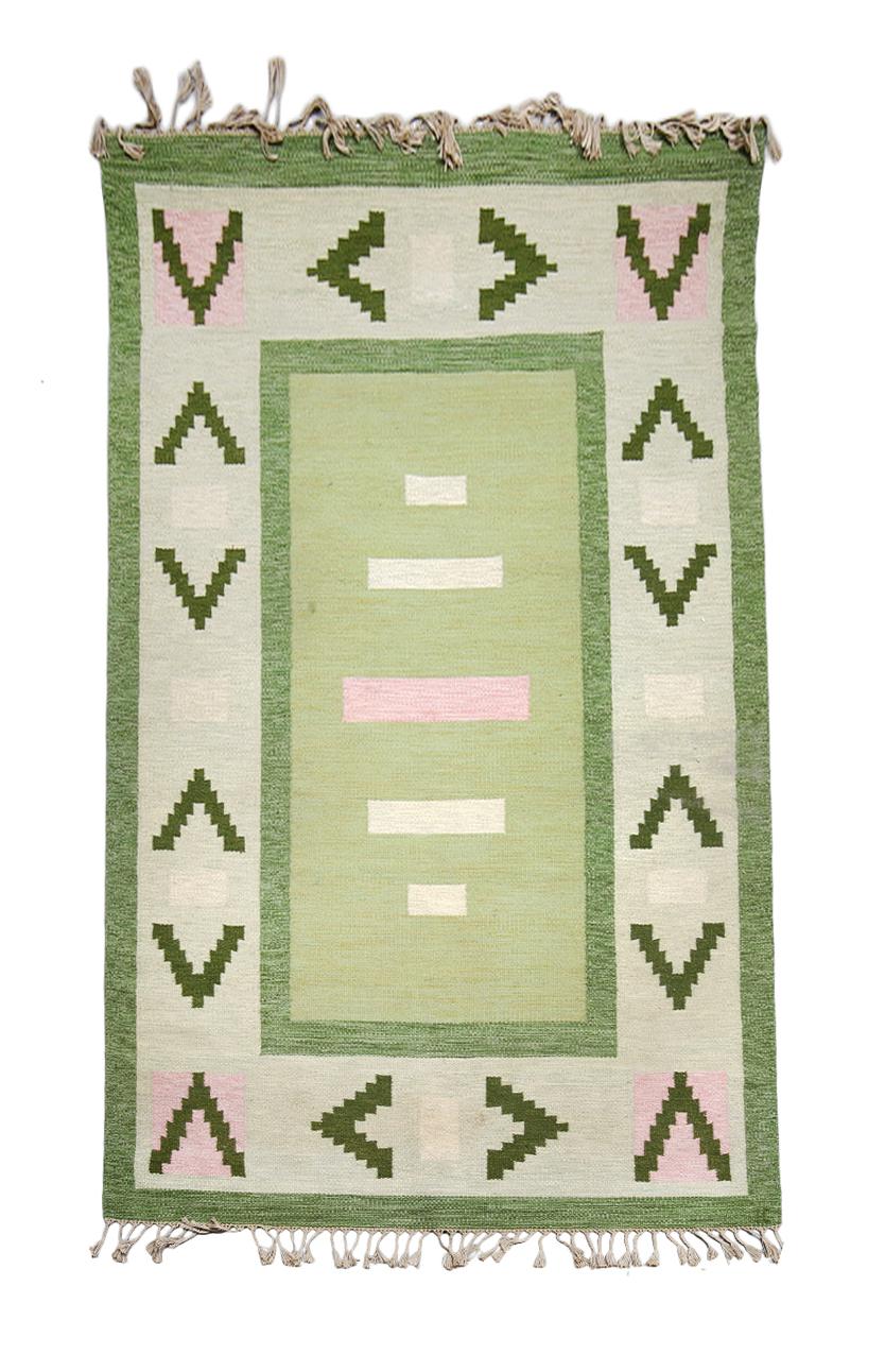 Large Mid-century Swedish rug, hand woven wool, flatweave ‘röllakan’ according to Ingrid Clarkson. Geometric pattern in green, pink, grey and lightgreen center field, 300 x 200 cm. Signed “IC”.

Halv-flossa or relief-flossa—translated half pile or