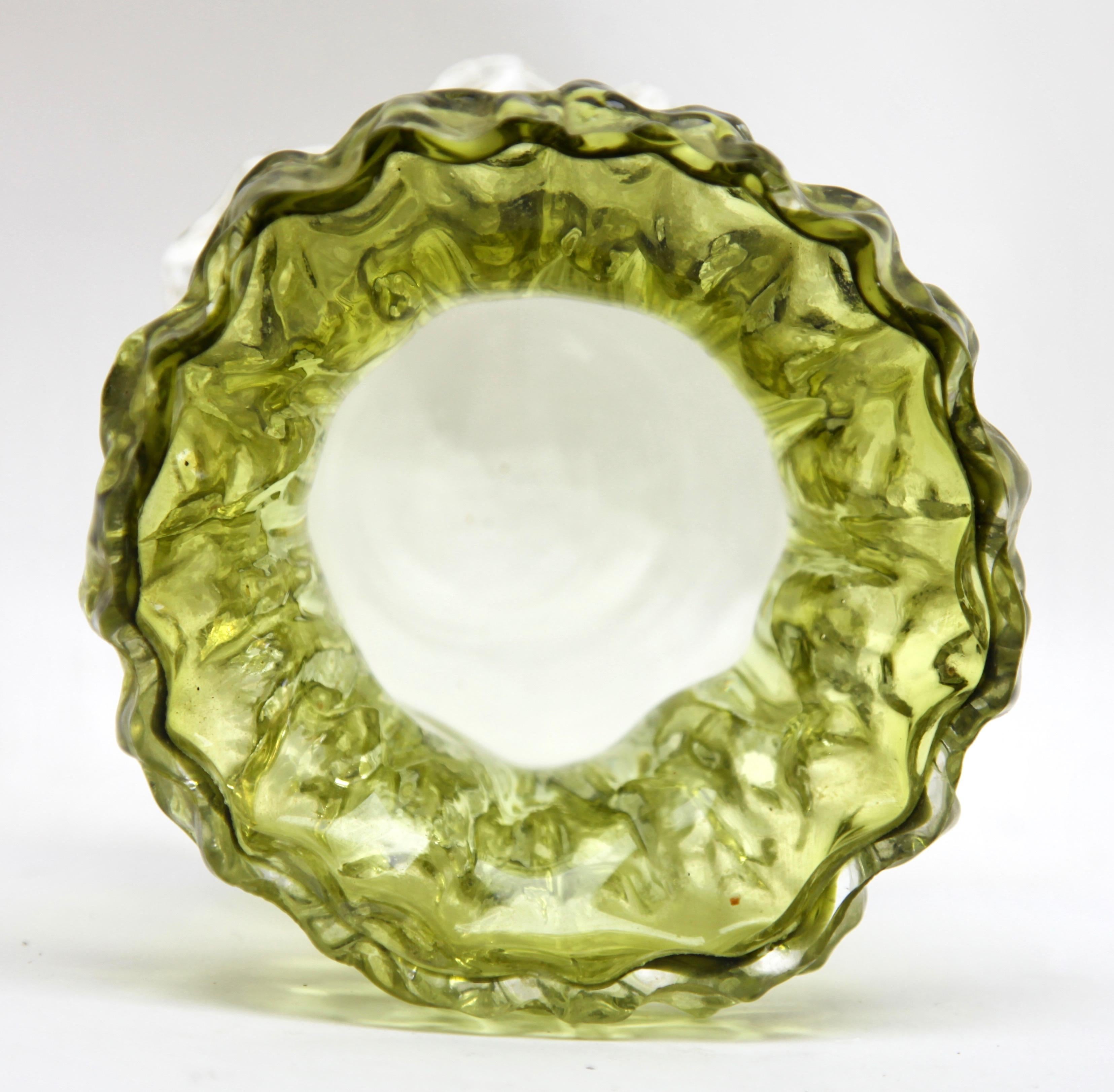Impressions made from tree bark were first used to make moulds in the early 1970s, as factories investigated new ways to bring surface texture to glass objects. Some models are colored throughout while others have a colored core with a thick