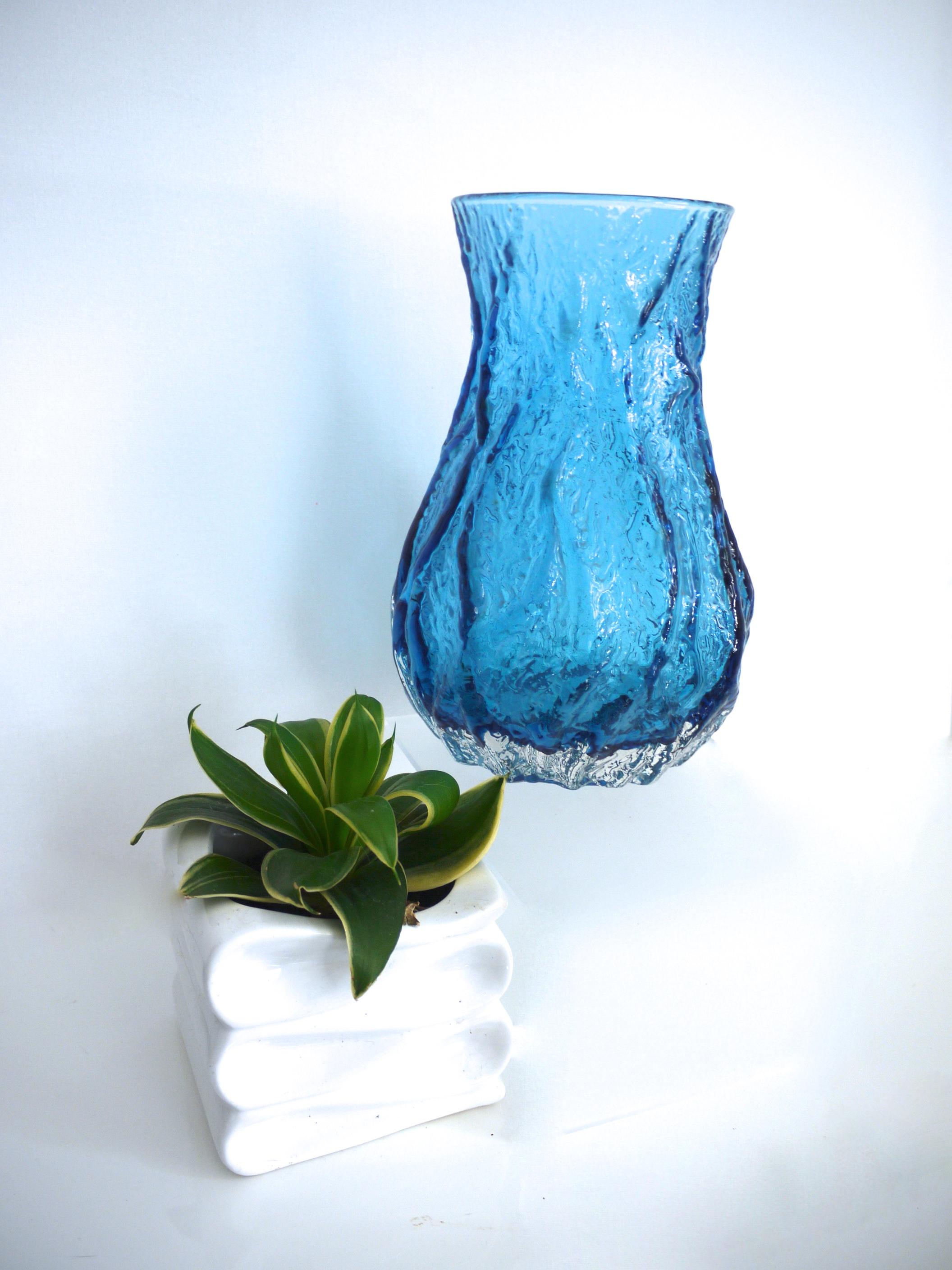 Ingridglas is also known as Ingrid Glashütte, Ingridhütte, IG Glass and Ingridglaser. This company was set up in the 1960s and folded in 1979. 
 
Among other glass pieces, Ingrid Glass are well known for their variety of textured bark vases, which