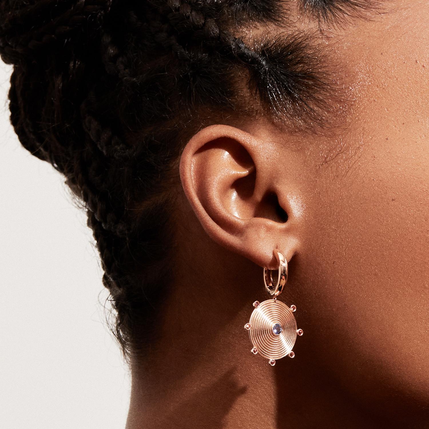 Our Ingrid Earrings are a versatile hoop & drop earring hybrid - the best of both worlds. Featuring a perfectly proportioned spiral rendered in gold, it's one of the oldest universal symbols representing themes of change, growth, and evolution. Ours