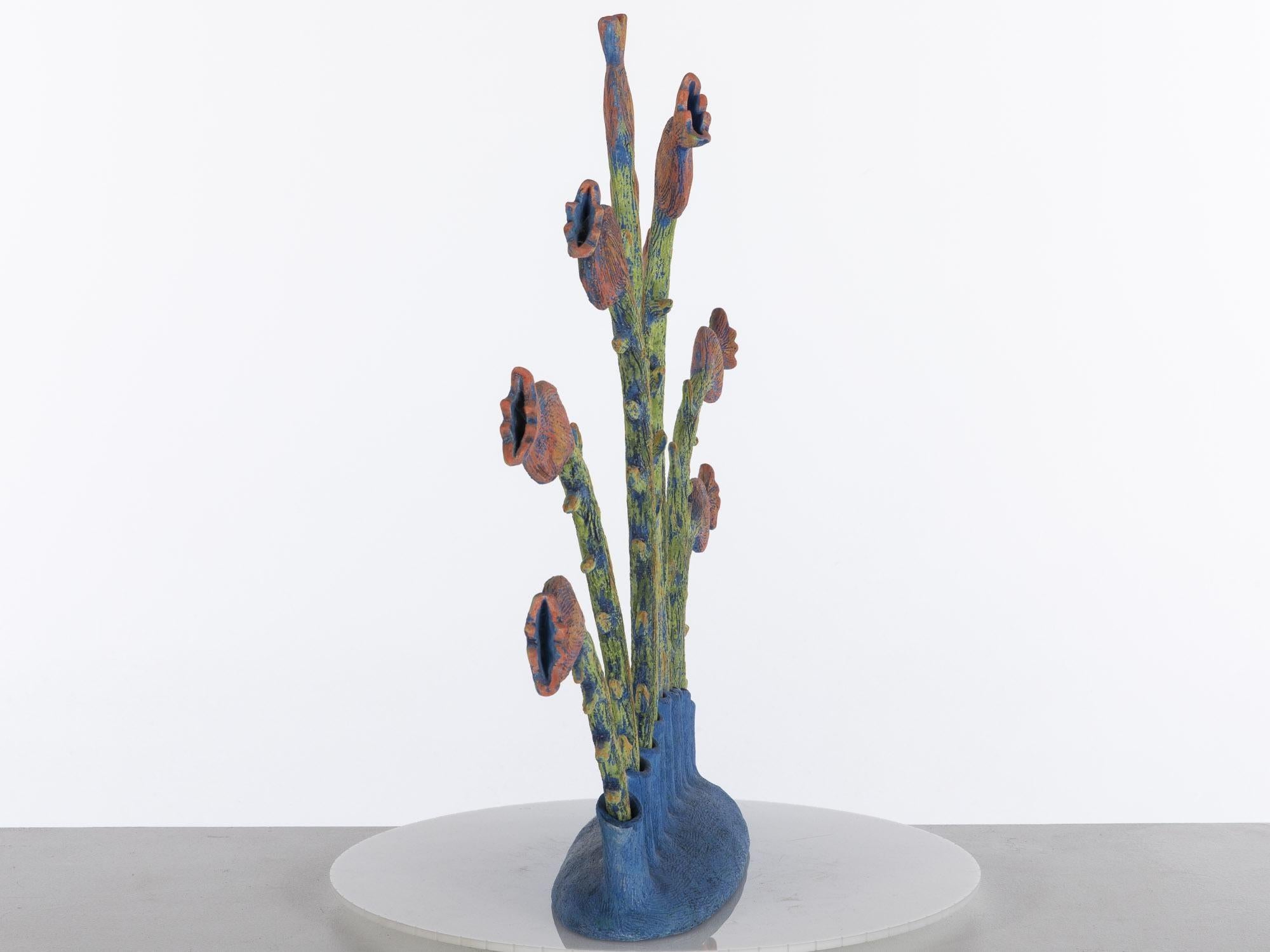 Ingrid Nicolai, ceramic floral sculpture, (Canadian, 21st/20th Century) signed, dated '99 and numbered '230' on base, blue base with removable flower stalks (stalks numbered on bases).

 Ingrid Nicolai's work is inspired by the pure forms of
