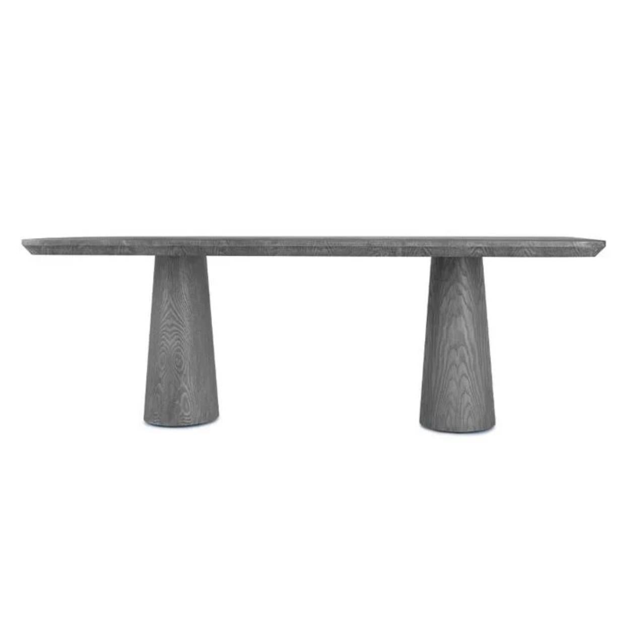 La table à manger Ingrid rappelle le meilleur du mobilier danois dans une version moderne pour aujourd'hui. Des bases ovales et un bord épuré sont les détails qui distinguent cette table. Le bois de châtaignier est disponible en version naturelle ou