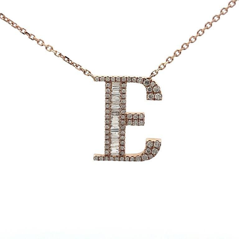 Introducing our exquisite diamond pendant necklace with a captivating letter E, this design is created using white diamonds in two different shapes, baguette, and round, with a total carat of 0.60 carats. These diamonds are G color with SI clarity.