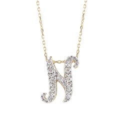 Ciondolo con iniziale "N" e pietre di diamante da 0,13 carati in oro bianco e giallo 14K