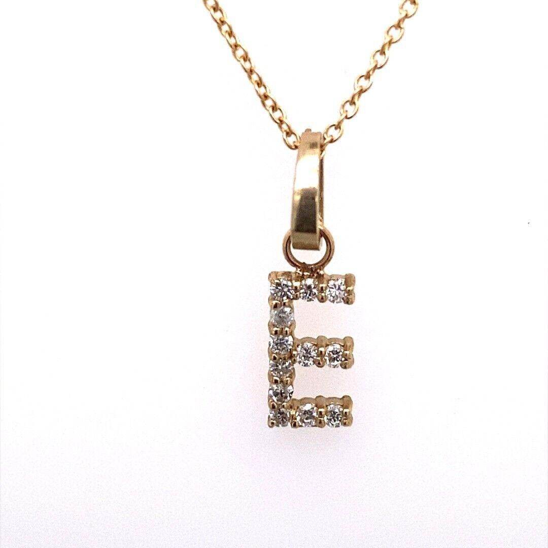 9ct Yellow Gold Initial Pendant Letter “E” Set With 0.12ct Diamond On 18″ Chain

The letter 'E' is for style, sophistication and allure. This pendant necklace is made from 9ct Yellow Gold and is set with 16 round brilliant cut Diamonds. The pendant
