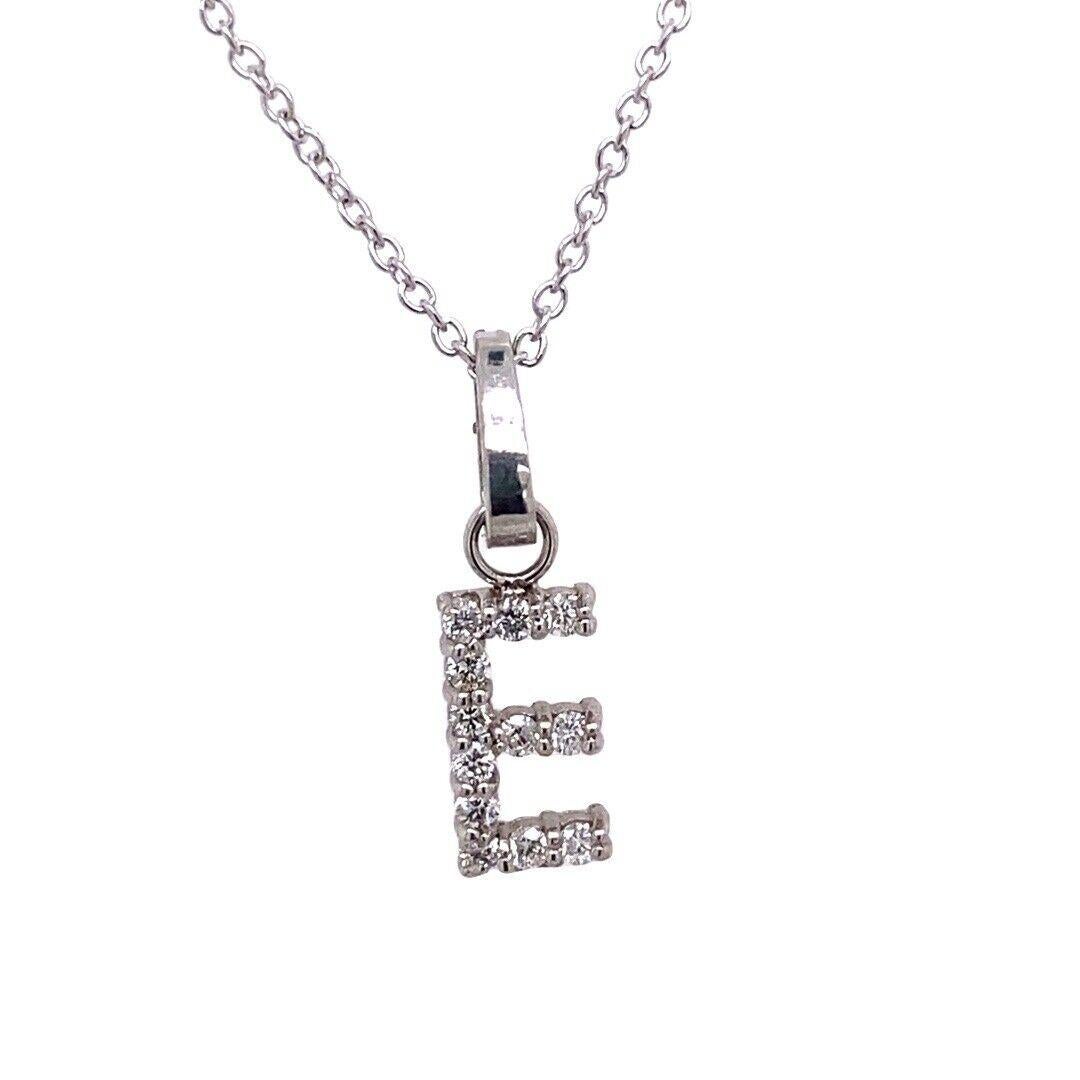 9ct White Gold Initial Pendant Letter “E” Set With 0.16ct Diamond On 18″ Chain

The letter 'E' is for style, sophistication and allure. This pendant necklace is made from 9ct White Gold and is set with 16 round brilliant cut diamonds. The pendant is