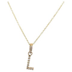 Pendentif lettre initiale L serti sur chaîne en or jaune 9 carats et diamant 0,12 carat