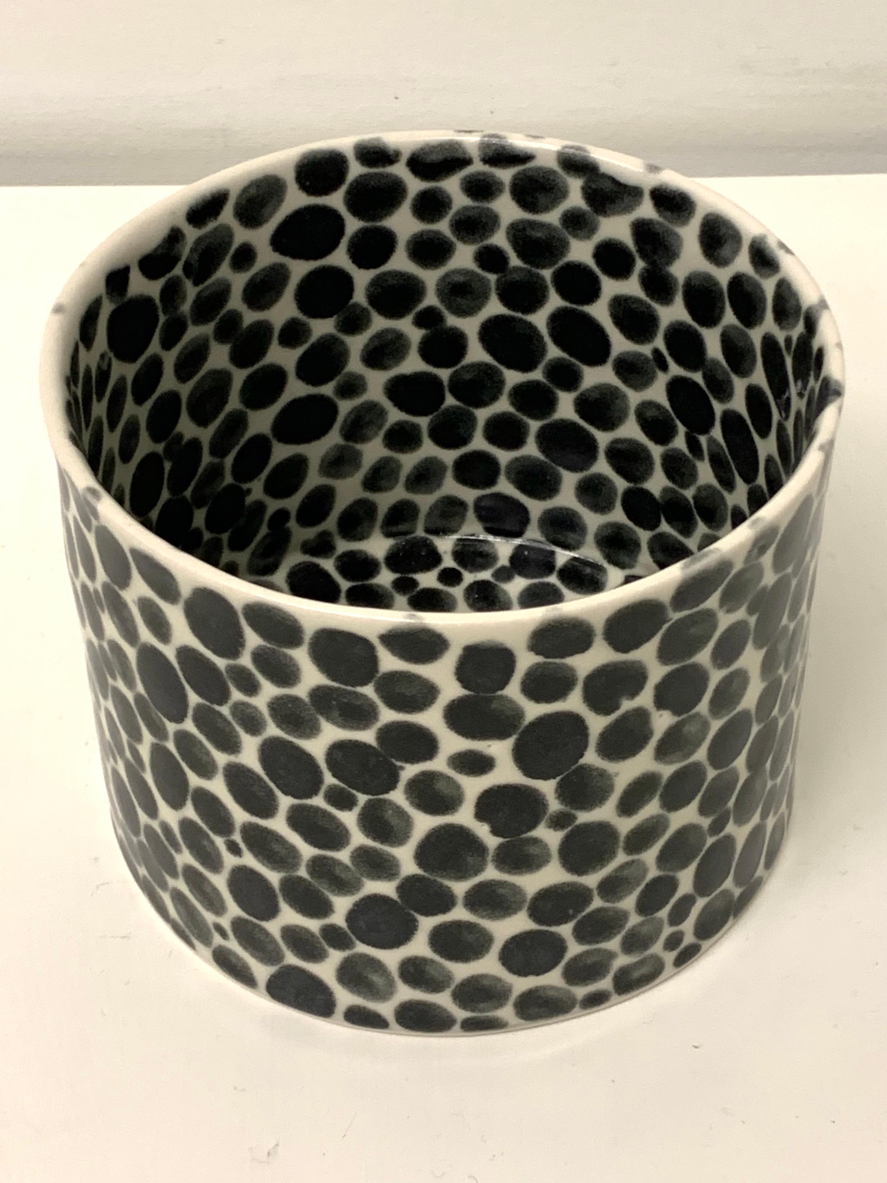 Porcelain vase in the shape of cylinder hand painted with black dots by artist Lana Kova. Made in Tribeca NYC.