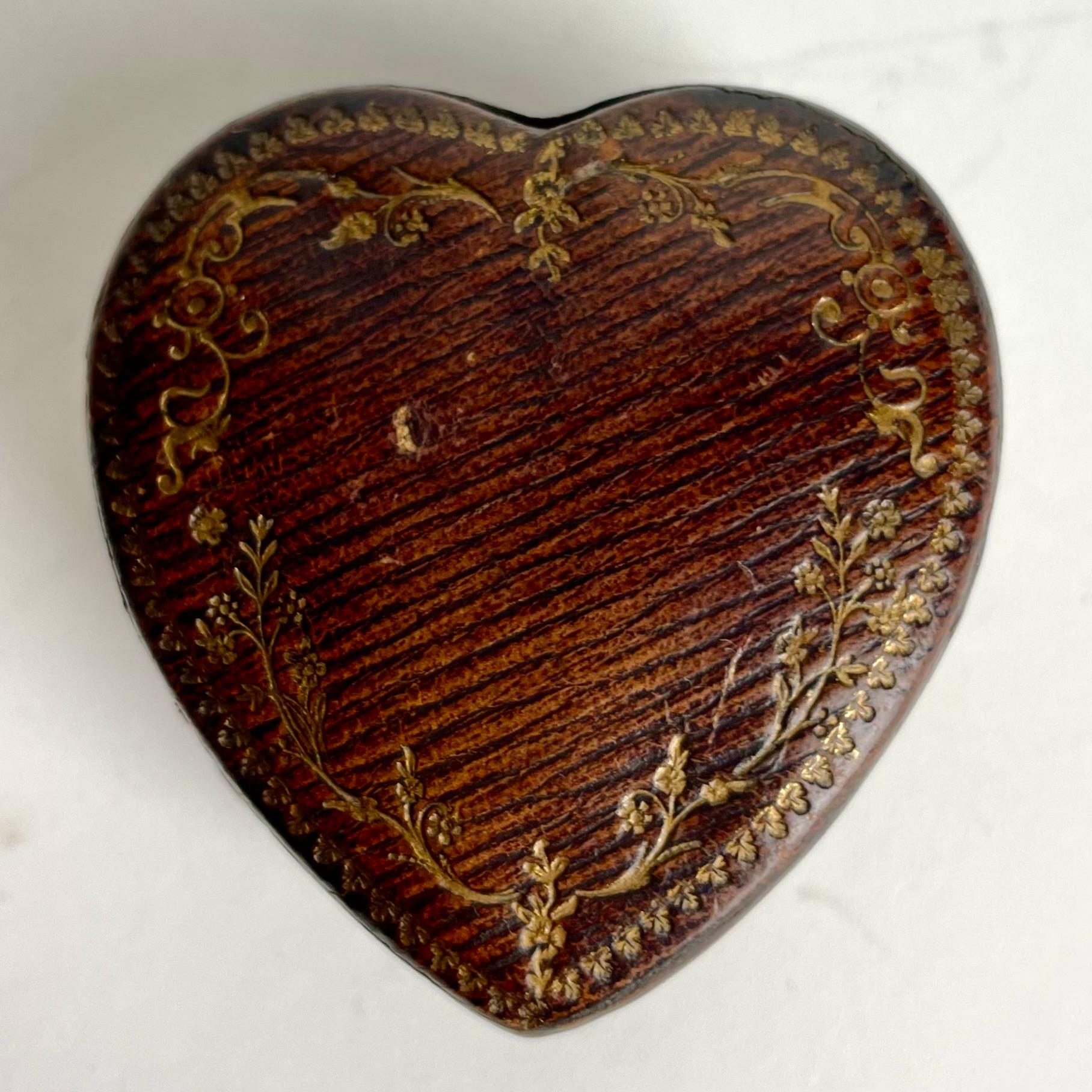 Beautiful Inkstand in leather in the shape of a heart for your love letters. Made in France during the late 19th Century.

Richly decorated with gilded leather and brass.

Wear consistent with age and use 