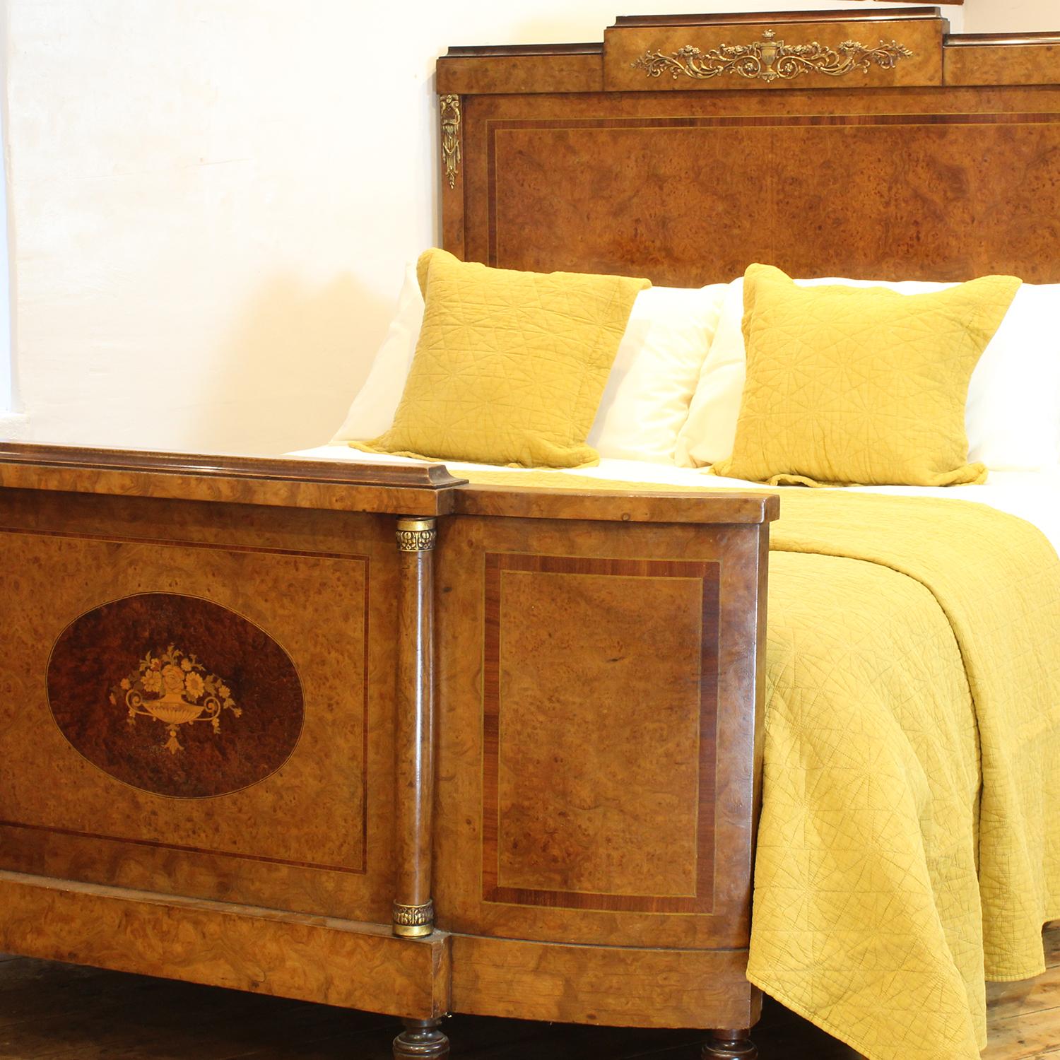 A fine antique bed with burr walnut panels and fruitwood inlay with bow foot, ormolu decoration and inlay feature of basket of flowers in the foot panel.

This bed accepts a British king size or American queen size, 5ft wide (60 inches or 150cm)