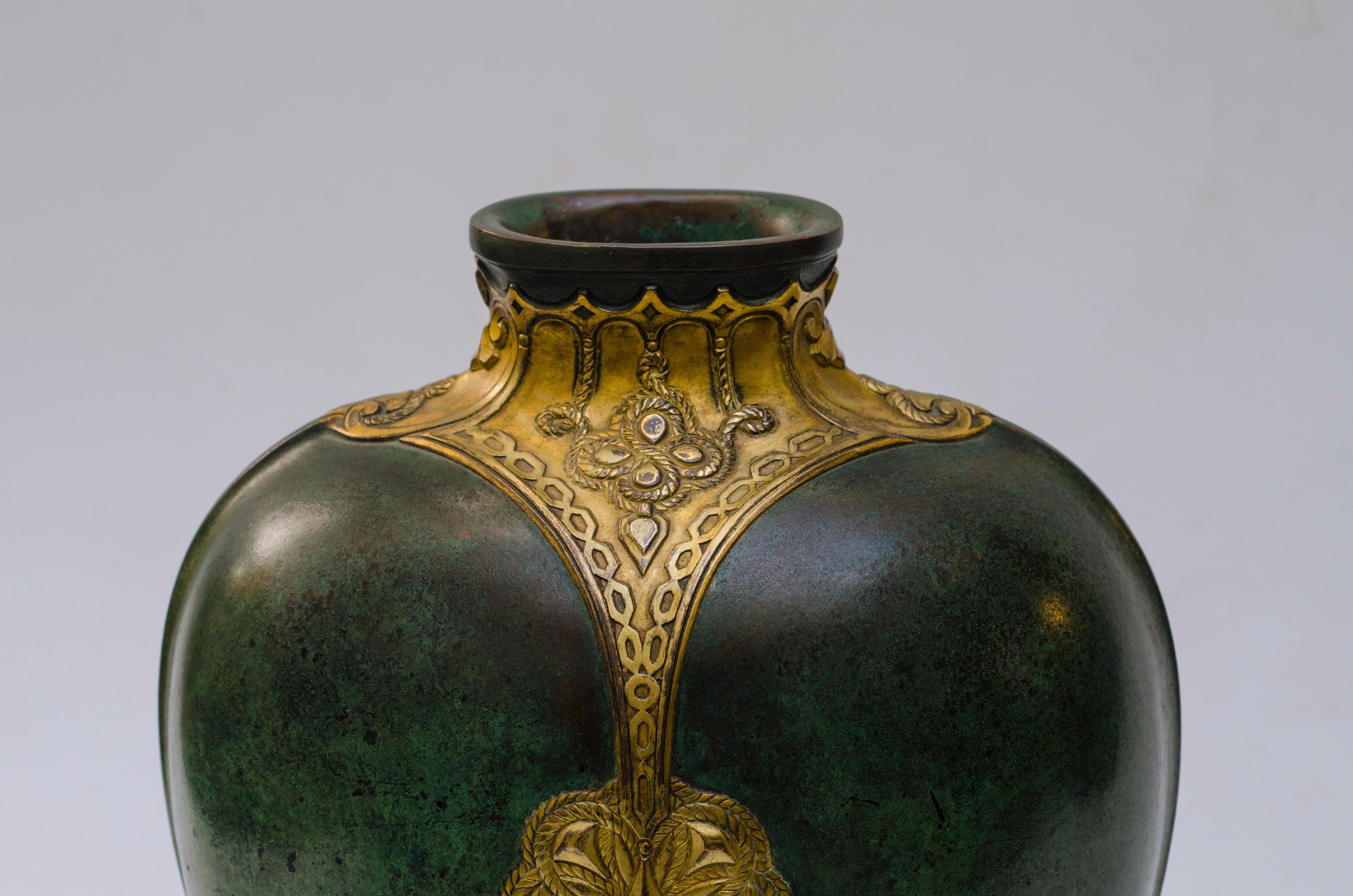 Green patinated bronze vase, with African ornaments and gold and silver inlays. Signed CHRISTOFLE.

Exhibited in Paris at the 
