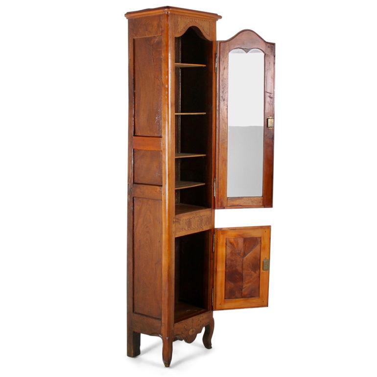 A unique cherry cabinet converted originally from a 19th century clock. Beautiful inlays of ebony and boxwood set this piece off beautifully. Brass locks adds to its distinctive appearance. Its narrow depth makes it ideal for a number of different