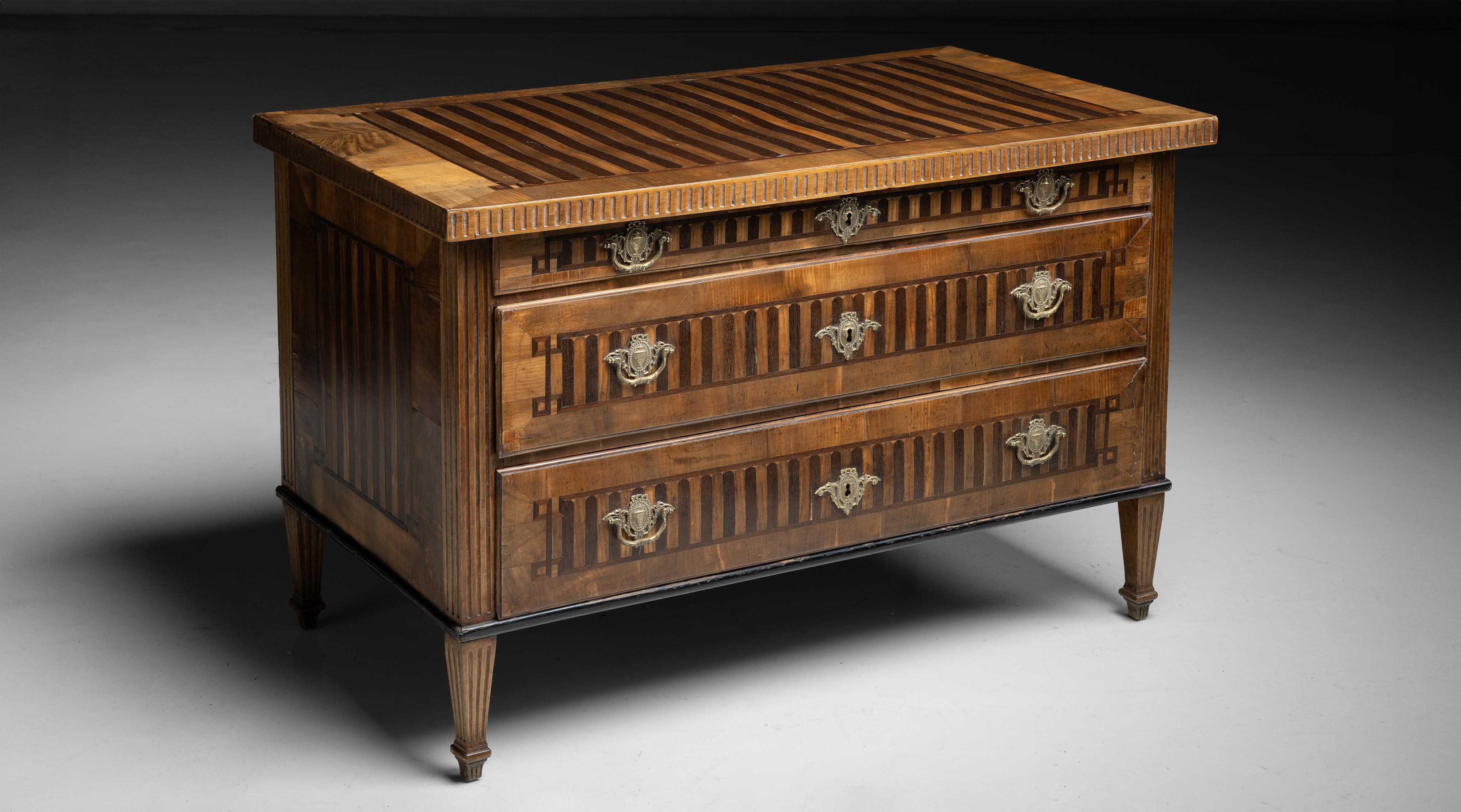 Inlaid Chest of Drawers

England circa 1810

Decorative chest with inlay to the top, sides and drawer front on reeded legs.

47.25”L x 25.75”d x 30.25”h