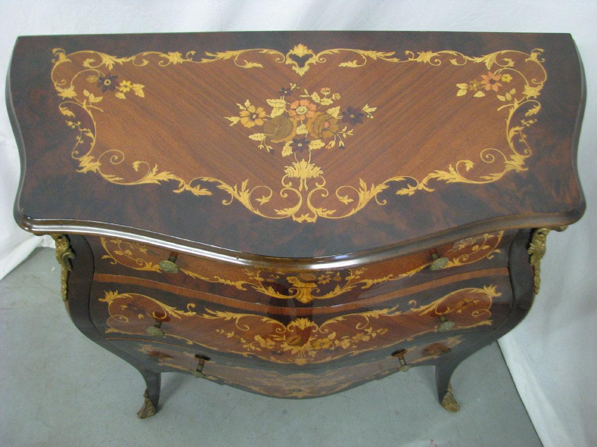 Inlaid chest of drawers in Rococo style
Very impressive and decorative Rococo style chest of drawers,
richly inlaid and decorated with metal fittings.
 
The furniture lines bent in all directions deserve special attention
and beautiful inlays,