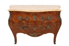 Inlaid chest of drawers with a marble top in the Louis XV style, France.