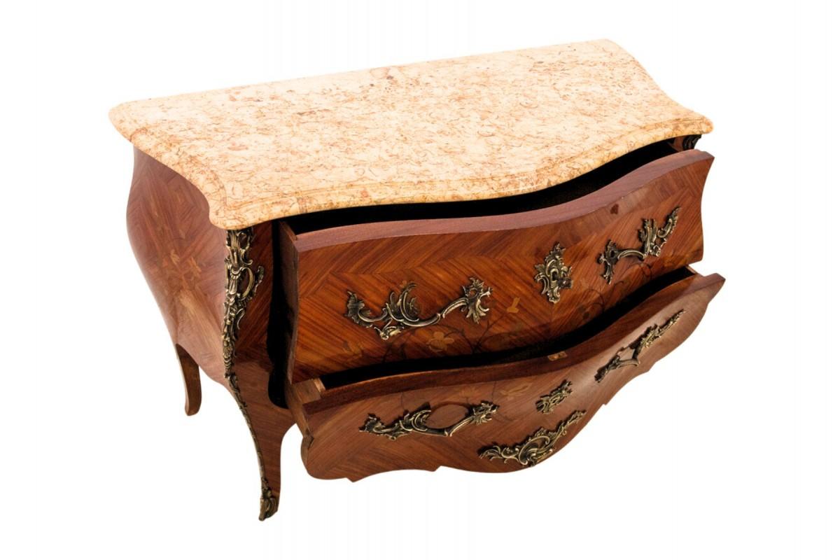 French Inlaid chest of drawers with a marble top in the Louis XV style, France. For Sale