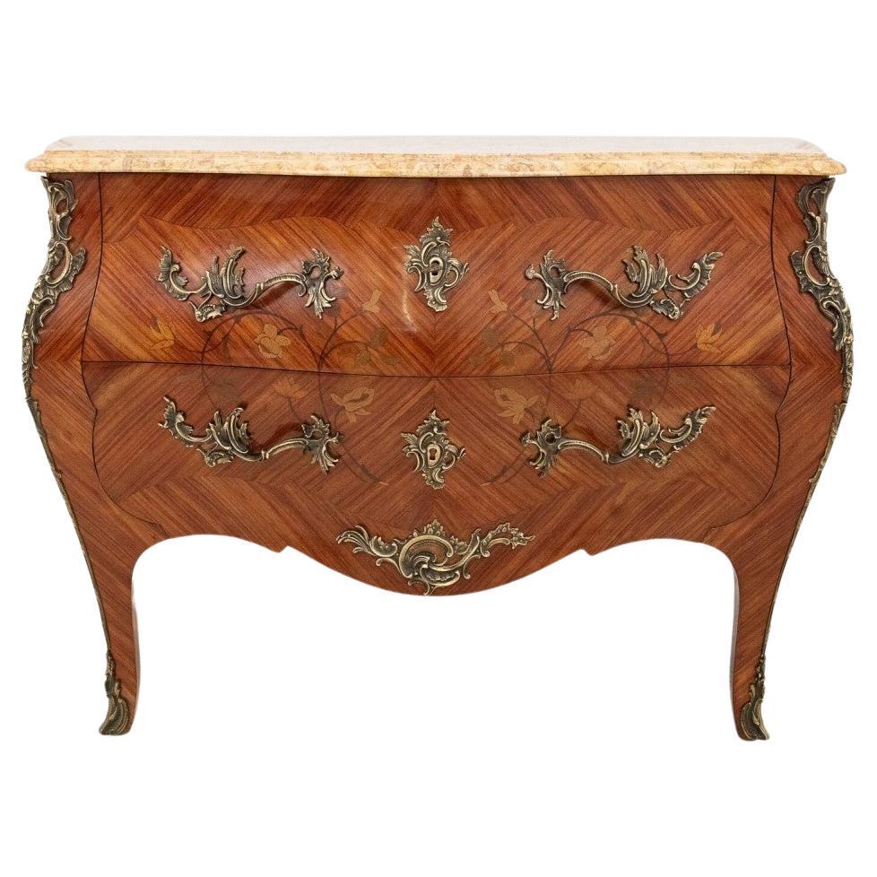 Inlaid chest of drawers with a marble top in the Louis XV style, France. For Sale