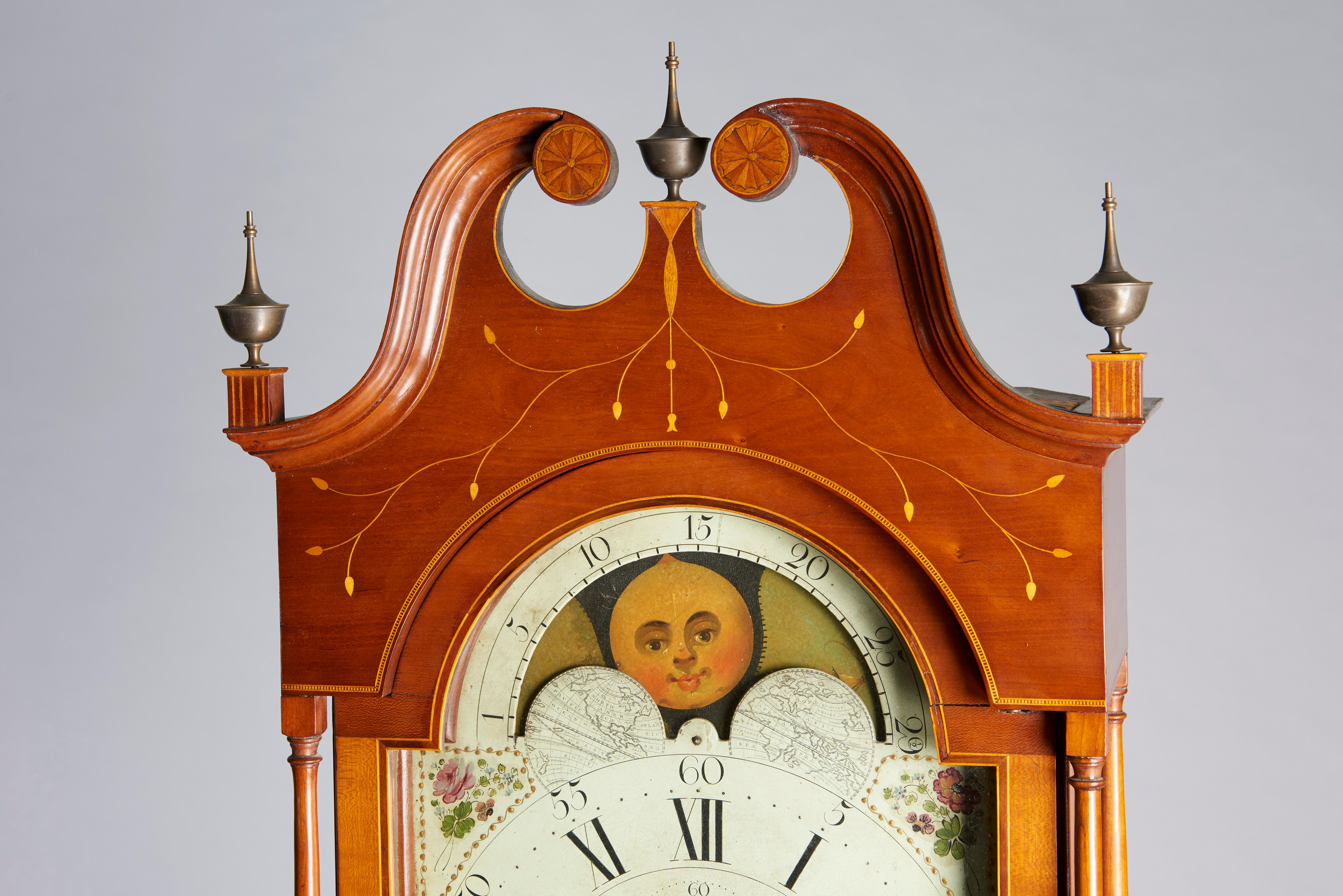 A nice small sized clock with original and exceptional inlay including a vine and berry design, a spreadwing eagle, and a beautifully rendered swan above a swirling shell pattern on the base. Lovely mellowed cherry color.
