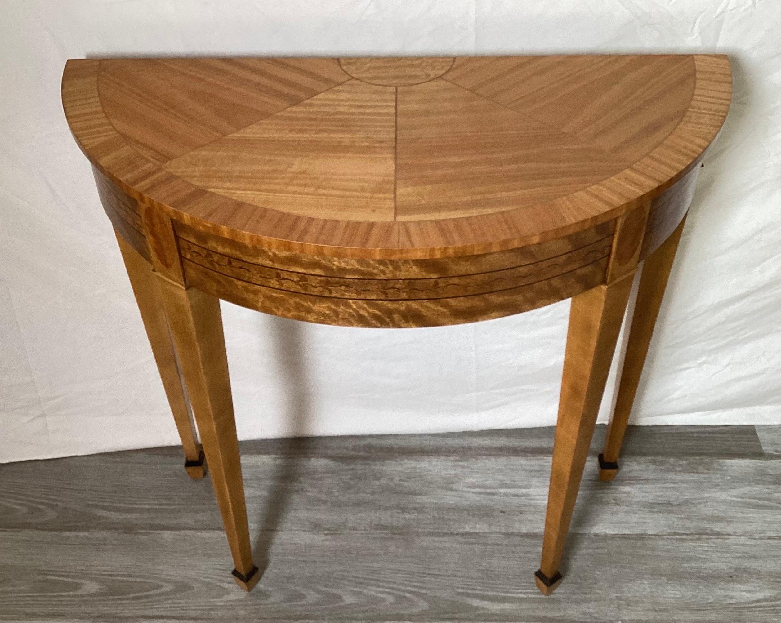 Beautiful inlaid demi-lune table by Baker for Laura Ashley. Nice small size with patterned vanes and wonderful inlays. Tagged on the bottom. 14