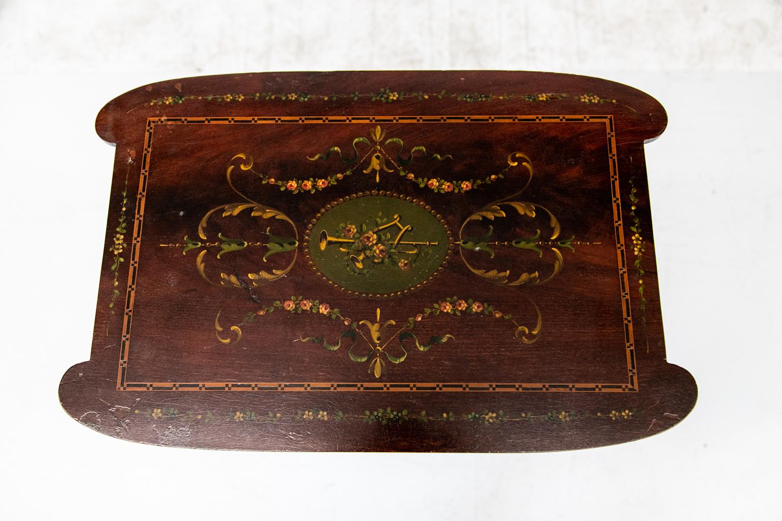 Inlaid floral painted mahogany occasional table, decorated with Robert Adam style floral painting and inlaid with boxwood and ebony bondings on the top and lower shelf.
  