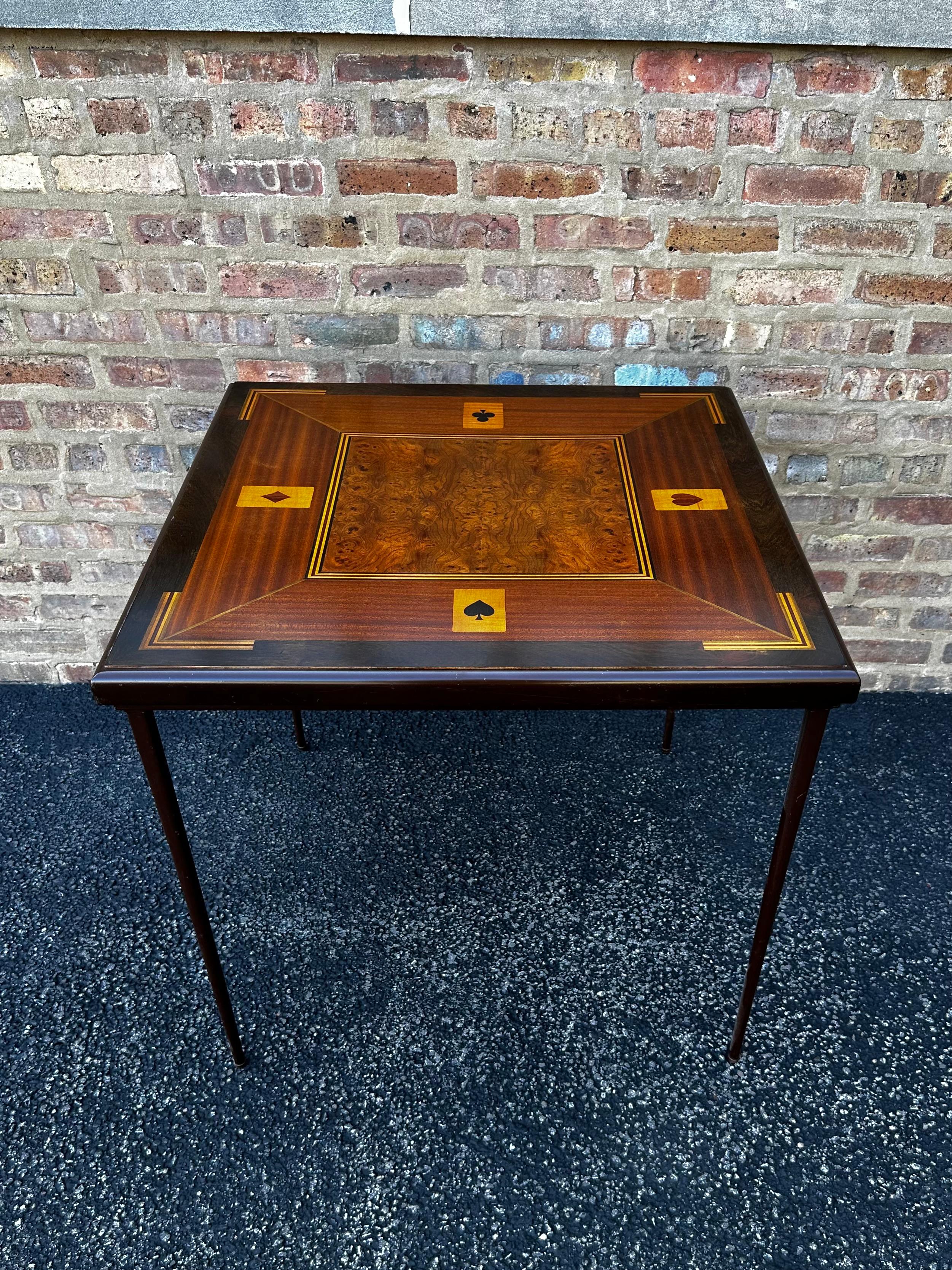 Inlaid Folding Game Table

This is a one-of-a-kind strikingly beautiful portable game table. The craftsmanship on this piece is just incredible! The surface of the table features burled walnut in the center, surrounded by exquisite inlay and