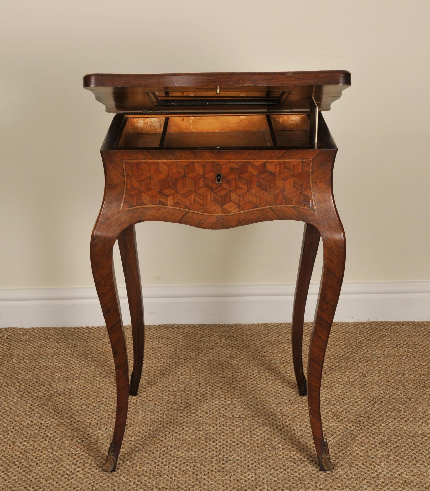 A beautiful French dressing table, circa 1880

 

With exquisite detail on the lid, a mirror on the inside of the lid, small compartments on the inside and delicate curving on the legs. With fruitwoods of kingwood, harewood and tulipwood