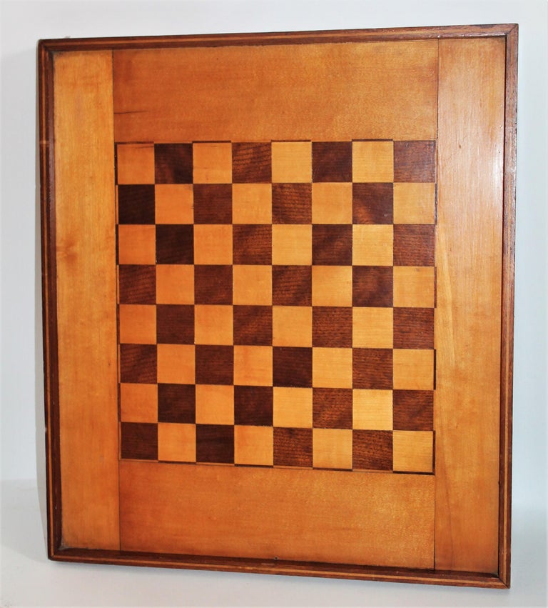 This fine large over size game board is inlaid walnut & pine combo. It has an inner inlaid border and picture frame molding. The condition is very good.