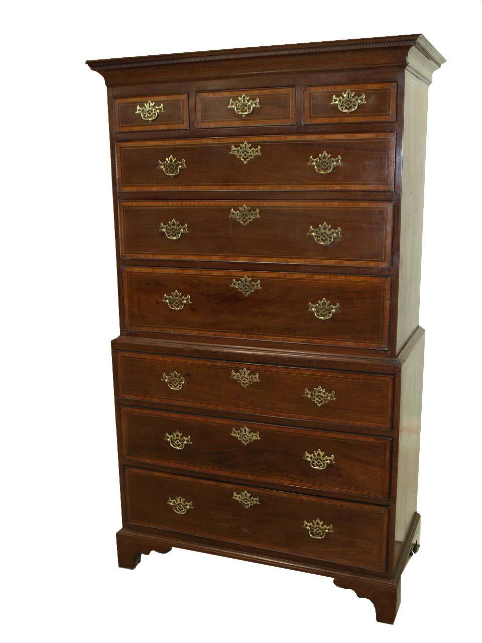 Inlaid George III chest on chest, the upper section with cove cornice above delicately crafted dentil molding. The three over three drawers are inlaid with a band of satinwood inside the cock bead, bordered by a combined string of ebony and boxwood