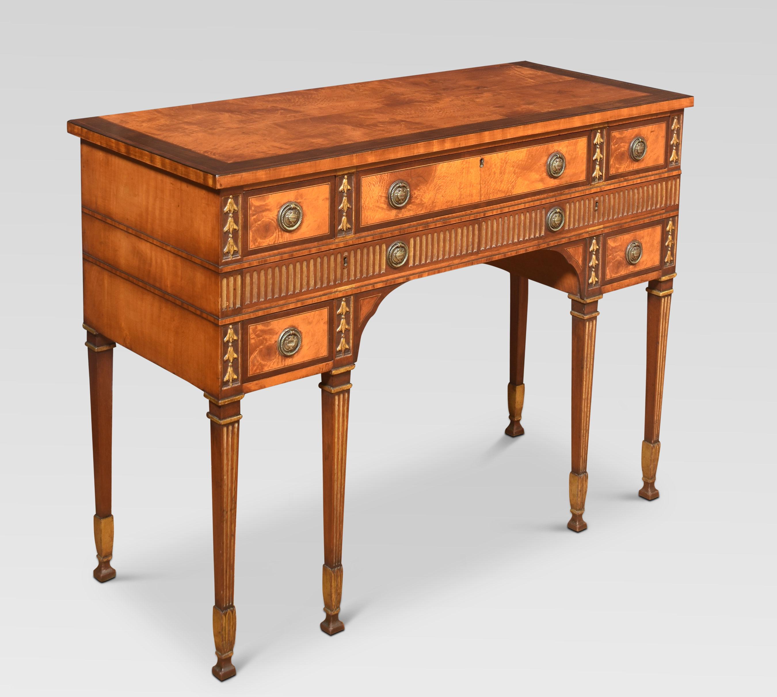 Inlaid Georgian style sideboard, the well-figured top with a cross banded edge, to the freeze fitted with an arrangement of drawers with brass circular handles and gilded carved bellflower decoration. All raised up on reeded square tapering