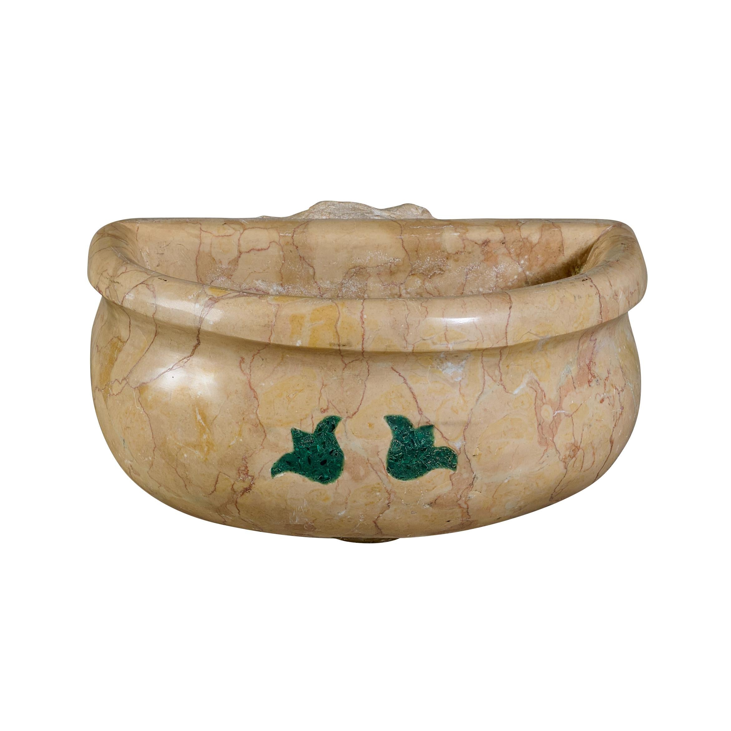 Holy water vessel with green marble inlay.

