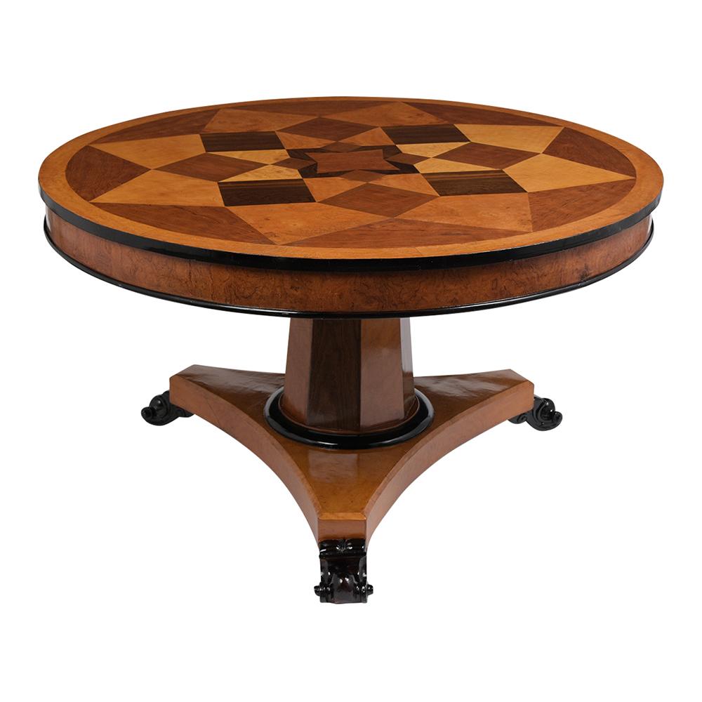 This Empire style center table is made out of maple/pine wood covered with fruitwood veneers that have been stained rich mahogany and black color combination with a lacquered finish. The tabletop has a handcrafted marquetry design and black trim
