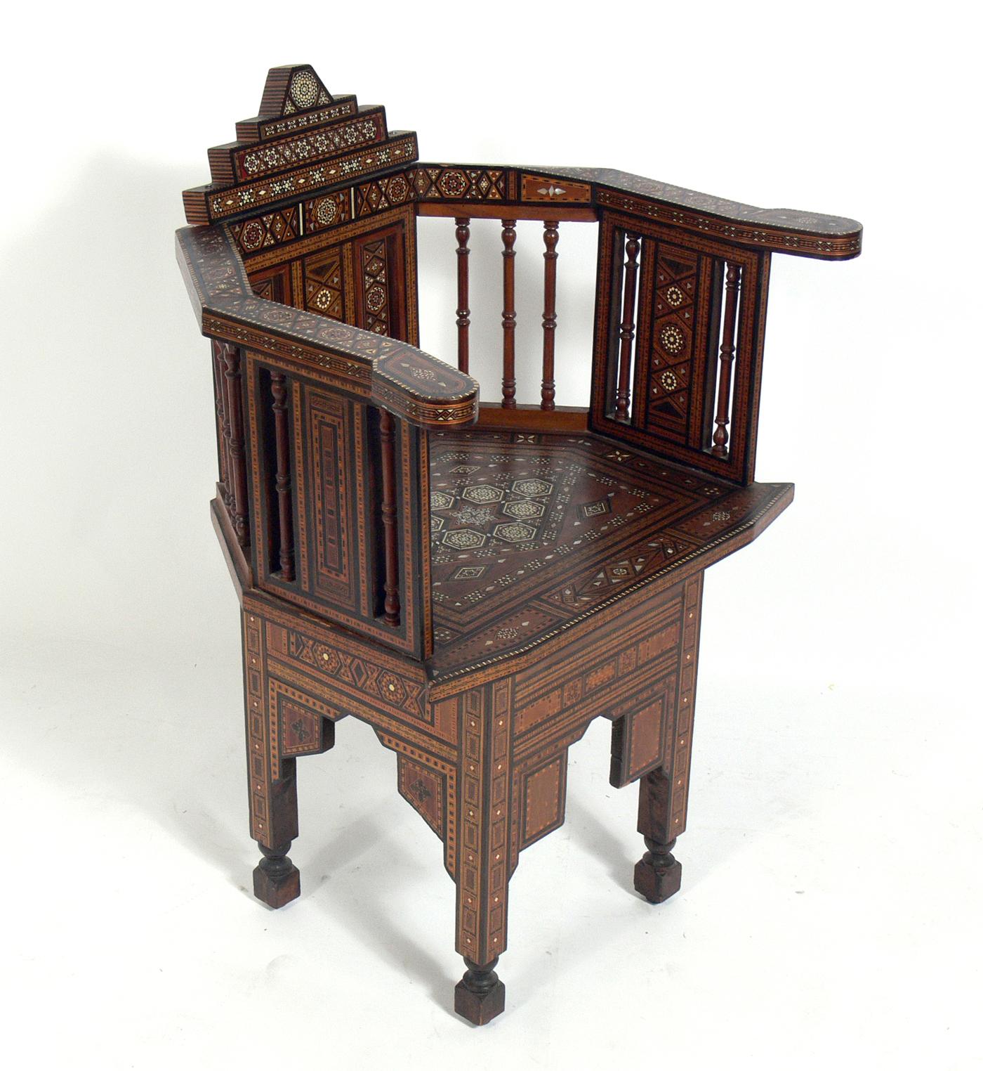 Inlaid Moroccan chair, in the manner of Carlo Bugatti, Moroccan, circa 1950s. Completely hand made with intricate inlay throughout. Retains warm original patina.