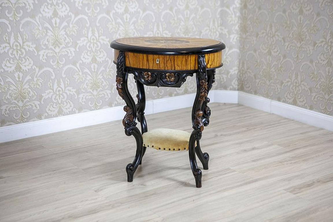 Inlaid Sewing Table of Various Woods from the Late 19th Century

We present you this elaborately decorated sewing table from the late 19th century, made of various types of wood.
The whole piece is placed on carved, inlaid legs.
The apron hides a