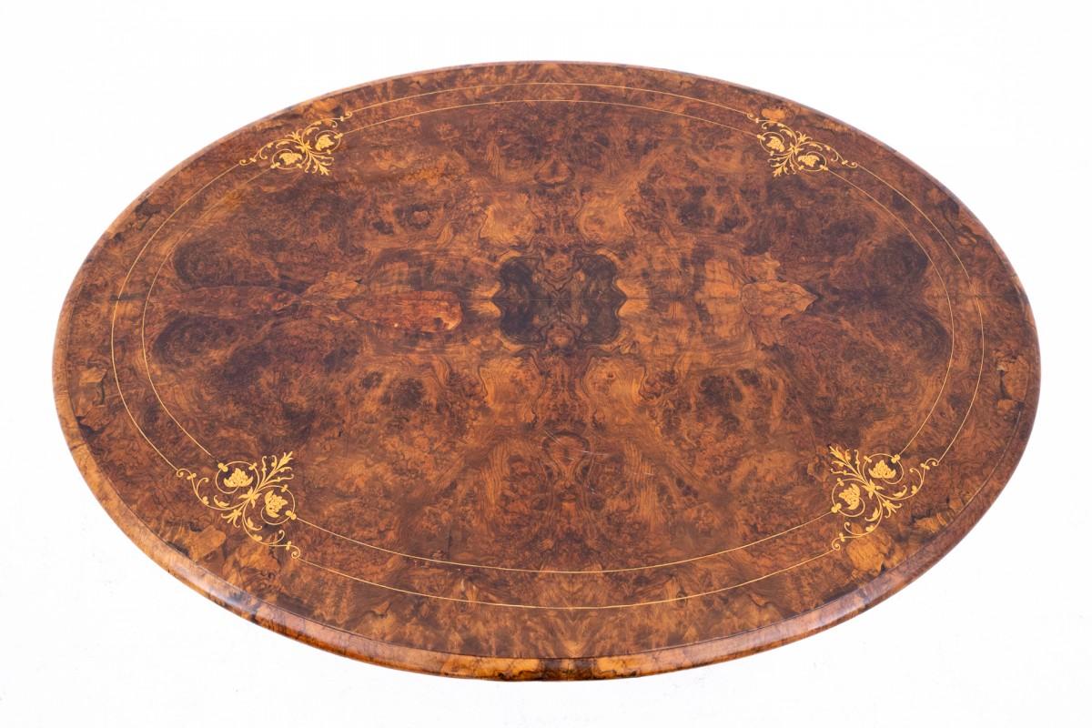 Antique table with an inlaid top from around 1890, Western Europe.

Dimensions: height 62 cm / length 137 cm / depth 100 cm