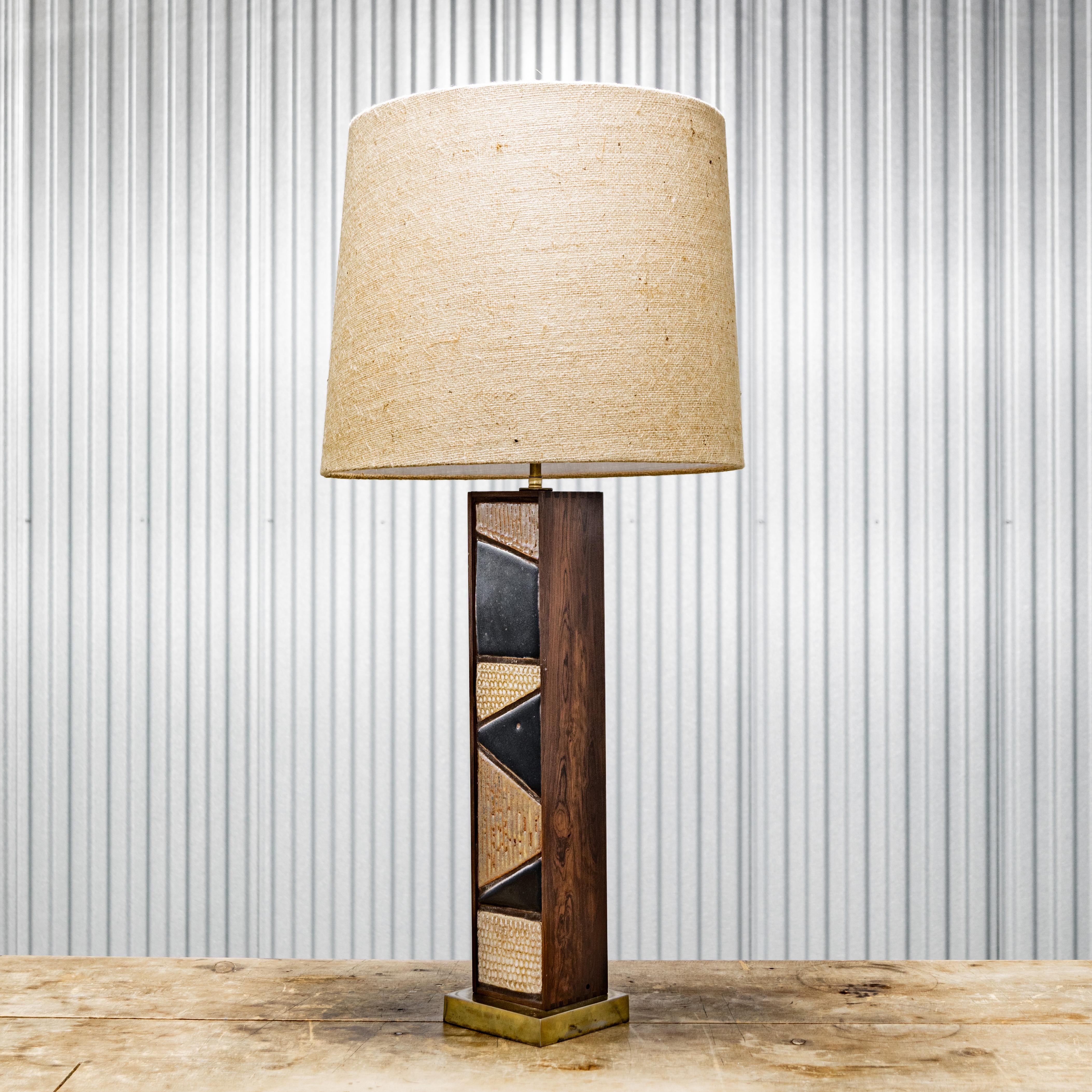 Brass and tile inlay column base table lamp with burlap shade, circa 1950s.