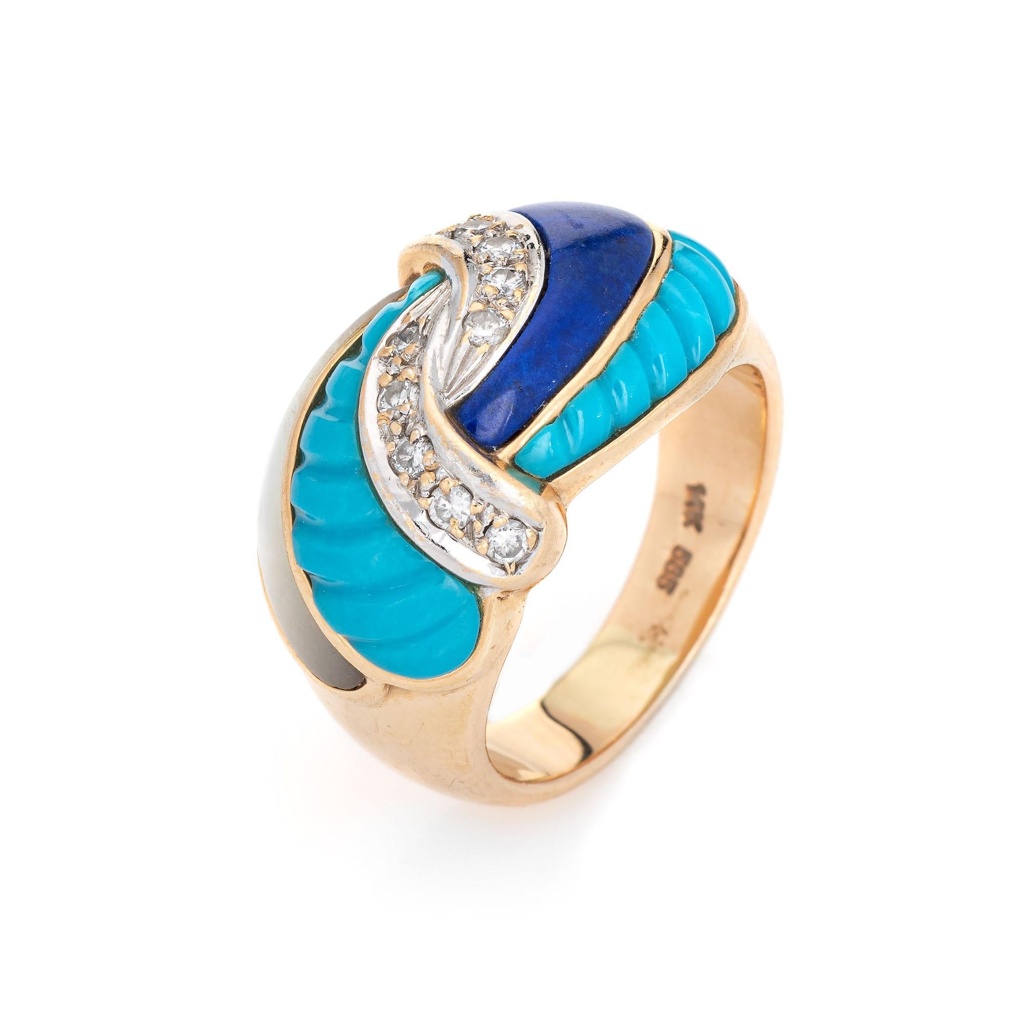 Stylish estate lapis lazuli, turquoise, mother of pearl and diamond ring crafted in 14 karat yellow gold. 

The band is inlaid with lapis lazuli, fluted turquoise and mother of pearl. The diamonds total an estimated 0.10 carats (estimated at I-J