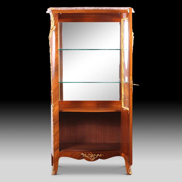 Early 20th century French kingwood single door vitrine or china cabinet with marquetry inlay and gilt mounts. Original marble top.
