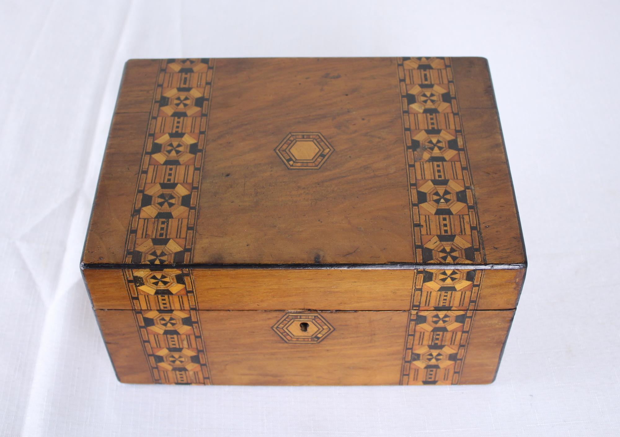 A decorative walnut Tumbridgeware box. Tumbridgeware being characterized as a form of decoratively inlaid woodwork, typically in the form of boxes, that is characteristic of Tonbridge and the spa town of Royal Tunbridge Wells in Kent in the 18th and