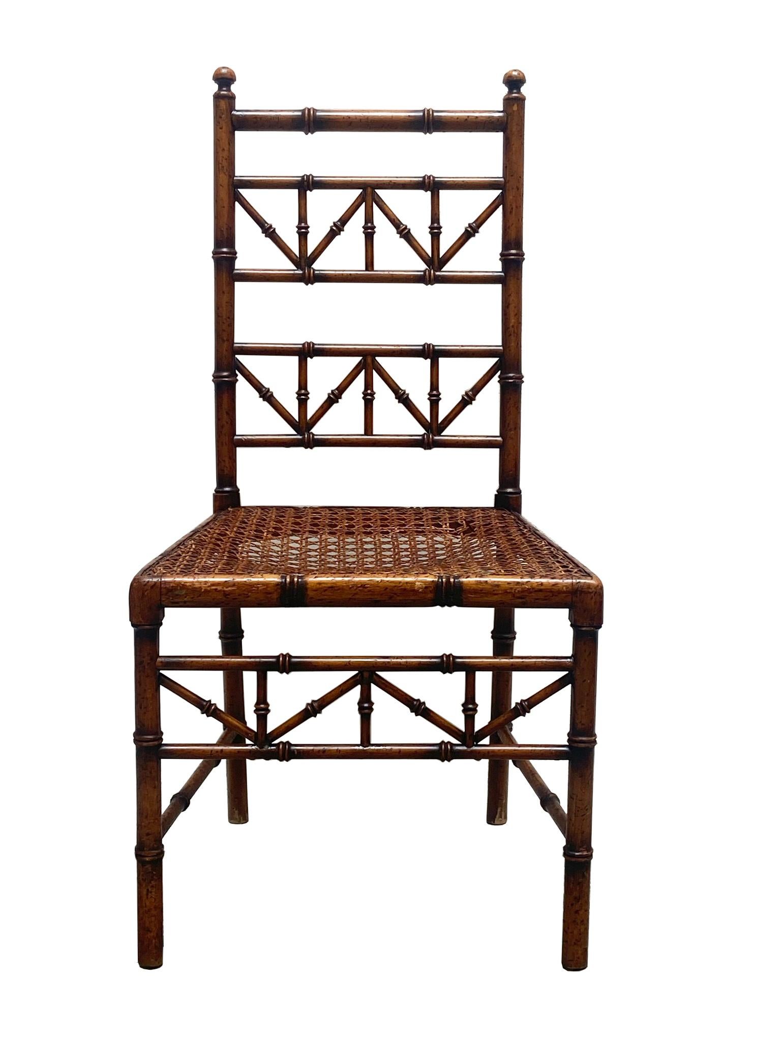 Elegant 1950s chair in inlaid wood, rattan, wicker and Vienna straw resting on four rounded and tapered feet. It is a generously sized model.