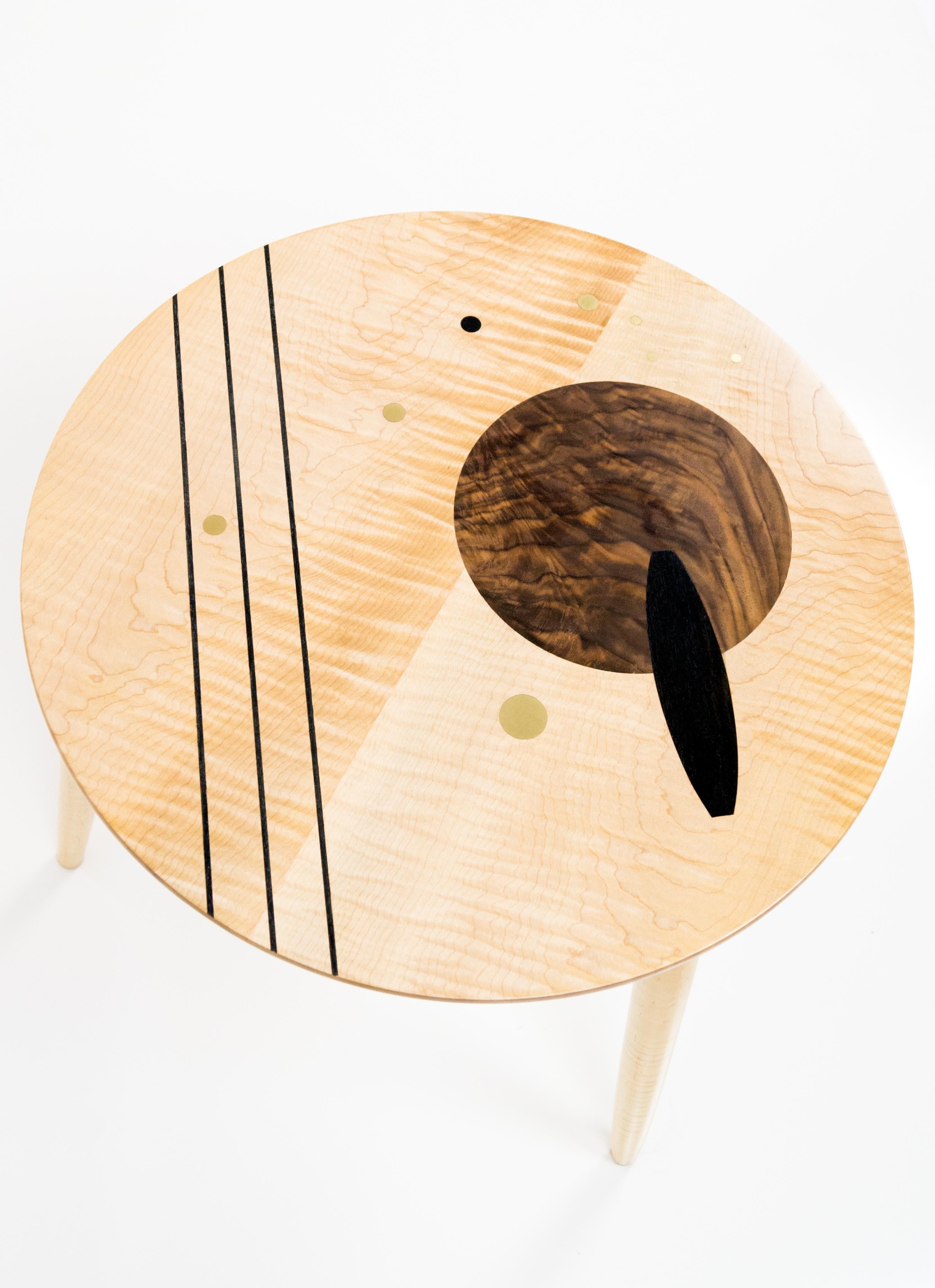 This inlay side table or coffee table is made from Ebony and Walnut woods. Inspired by the geometrics forms in mid-century modern design, this piece would look great in nay vintage inspired or contemporary space. This table is hand crafter by the