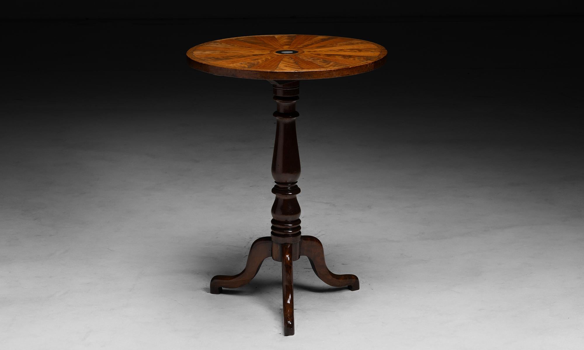 Inlay Tilt Top Table

Belgium circa 1900

Circular top with Mahogany, satinwood and mother of pearl inlay, turned mahogany base on three legs.

22”dia x 30”h