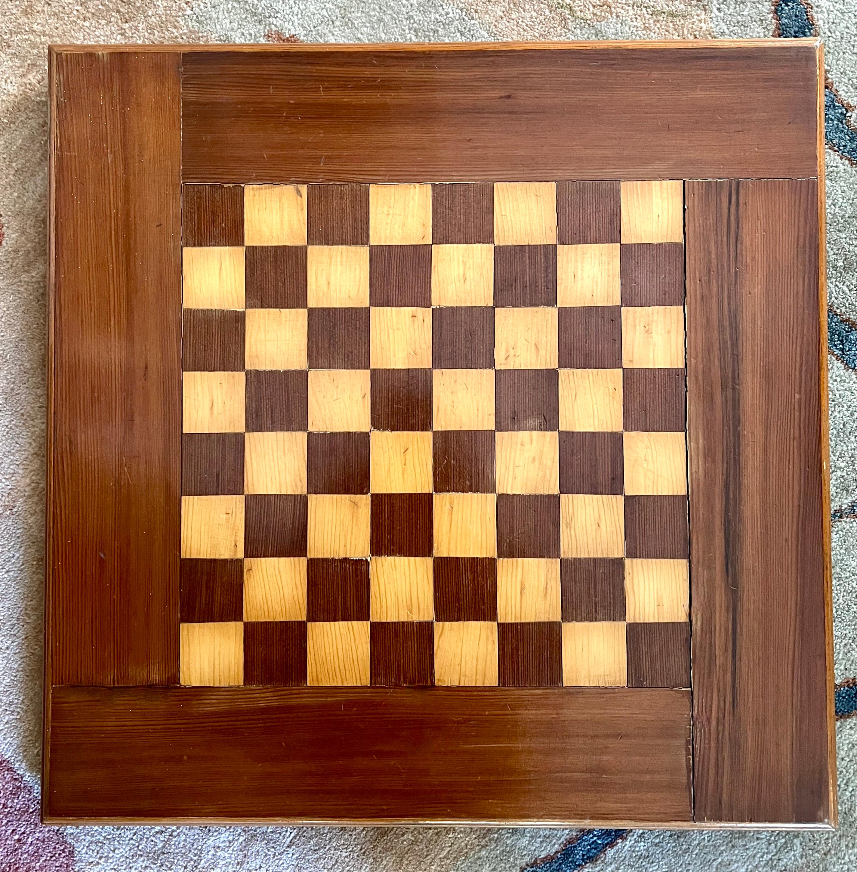 A wonderful and very large chess or checker board made of inlay wood with a 3.75