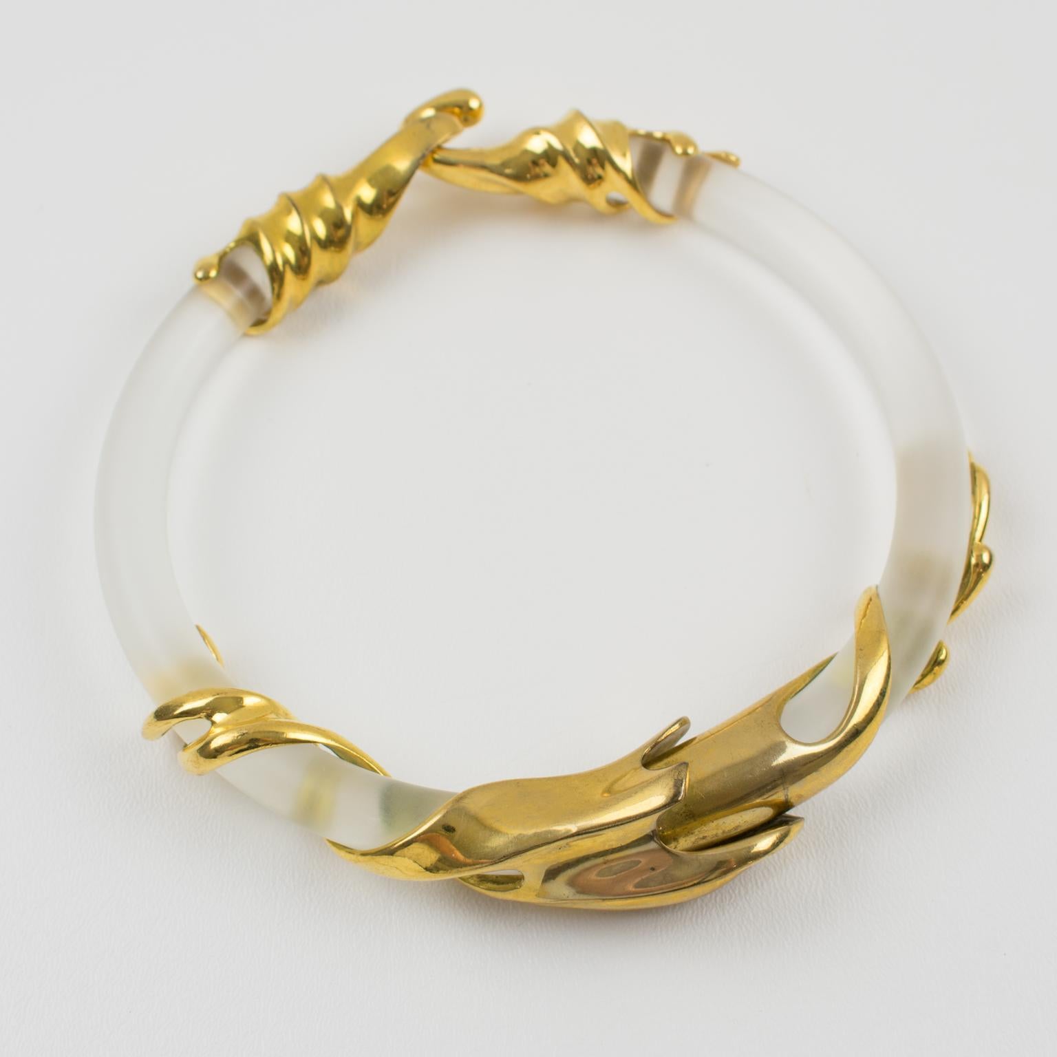 Outstanding sculptural Lucite choker necklace by Inna Cytrine Paris. The bold rigid collar necklace is fully articulated. Futurist gilt bronze metal embellishments wrap around the frosted lucite band. Fits very nicely around the neck. Large hook